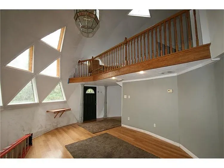 Here's the entry—dome ceiling, sharp windows. Cool, maybe too much? From this angle, spaceship.