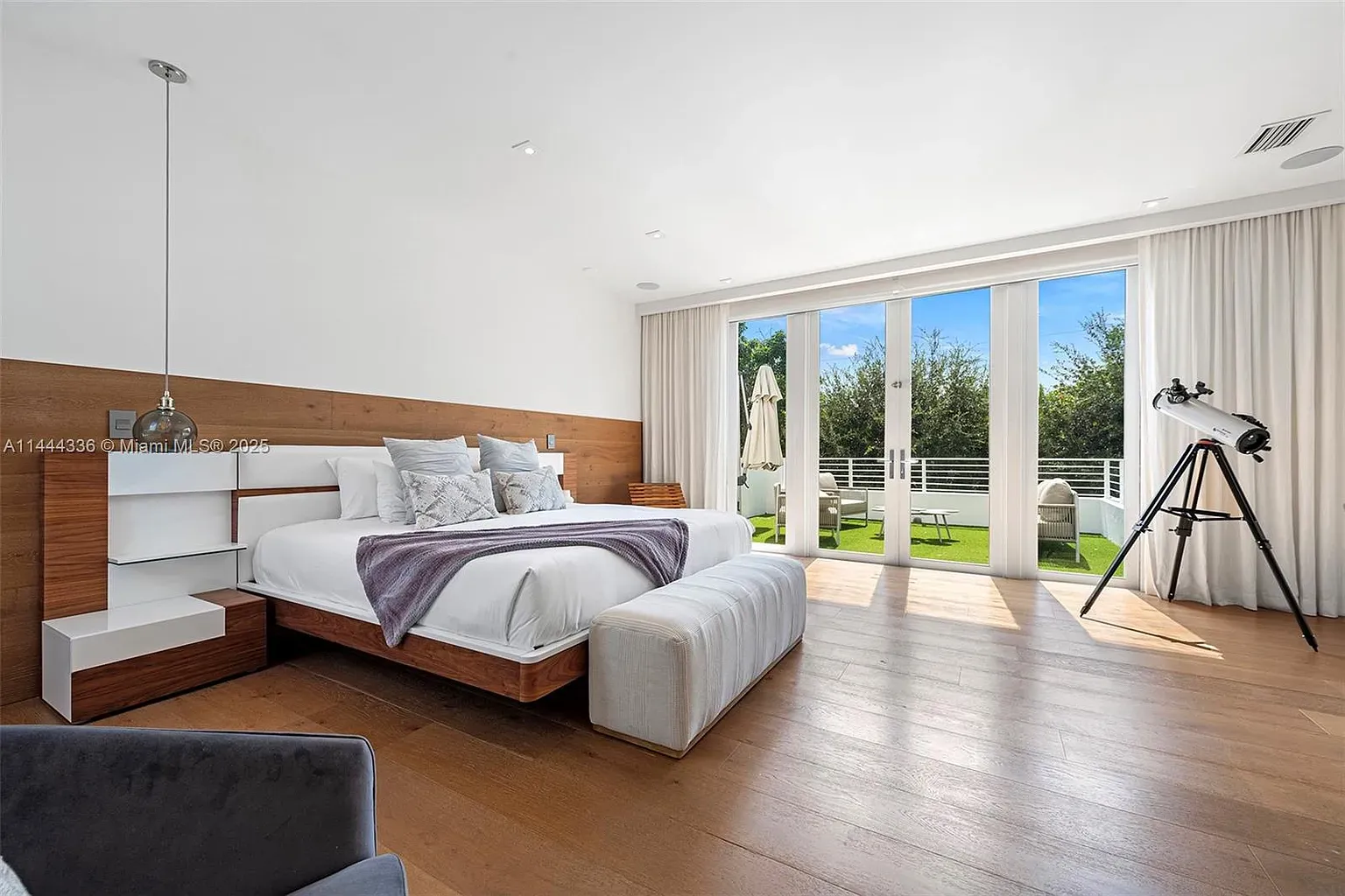 Another bedroom. walnut headboard, crisp linens, zen lighting. Instant nap zone.