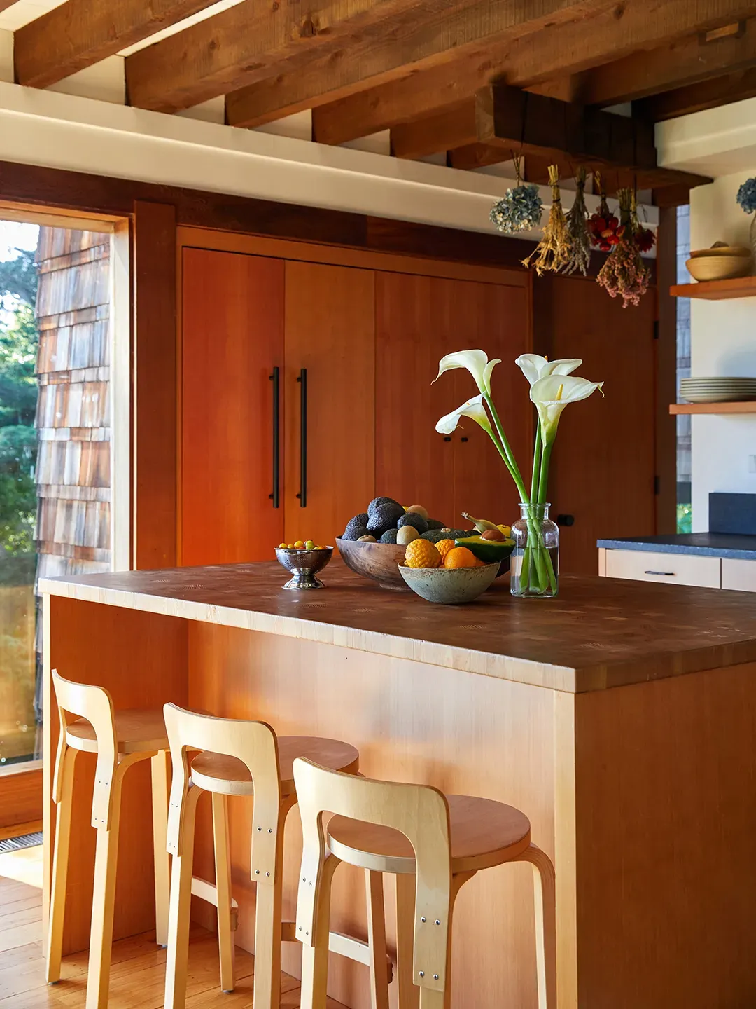 Here's the kitchen—huge wood island dead center. Cook, hang, repeat.