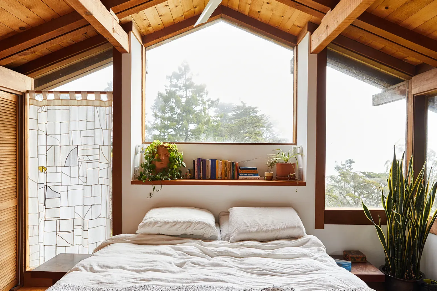 A-frame loft energy. Triangular windows make everything feel a cabin postcard.
