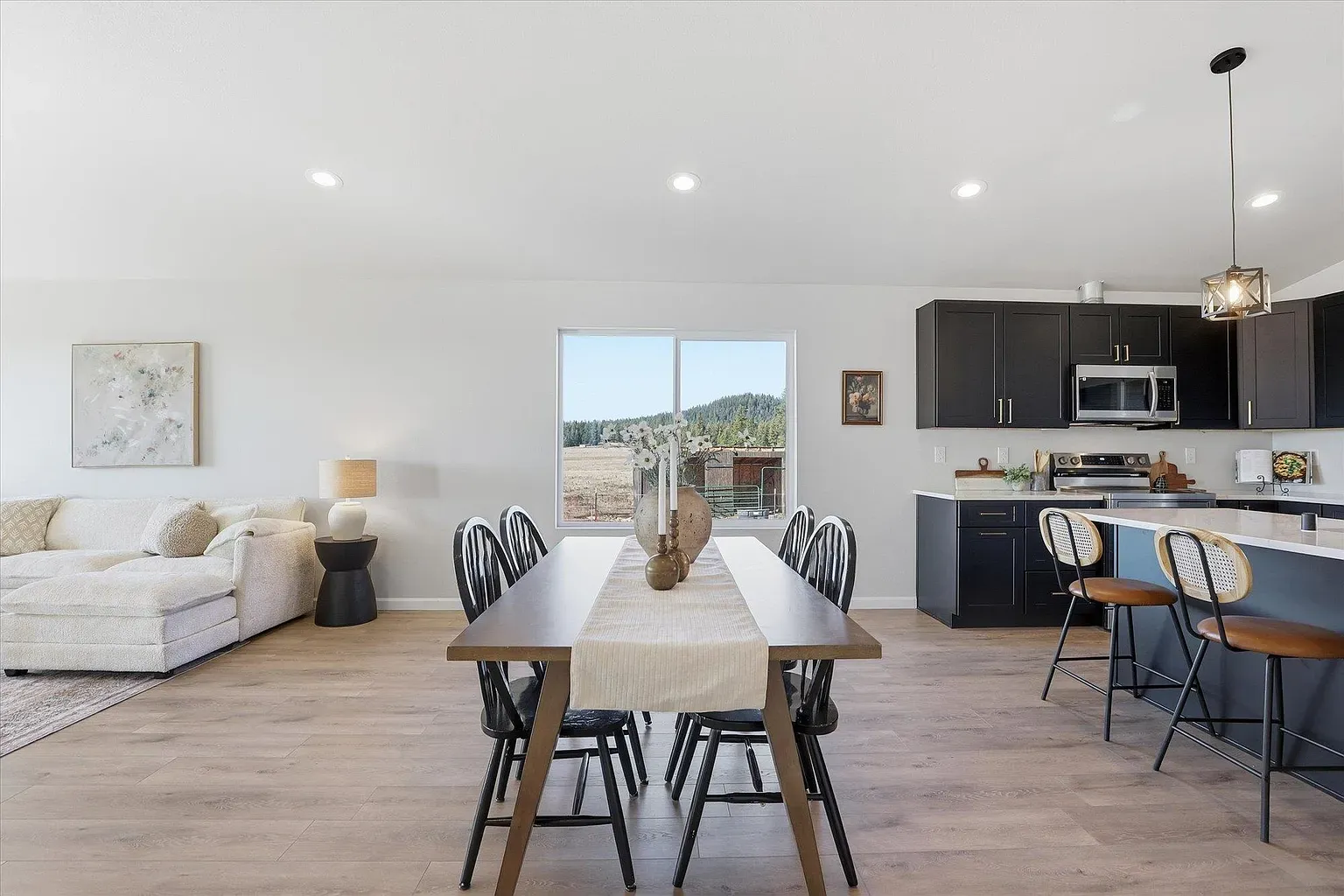 Open living/dining keeps it airy. Kinda model-home clean. Where do the crumbs go?