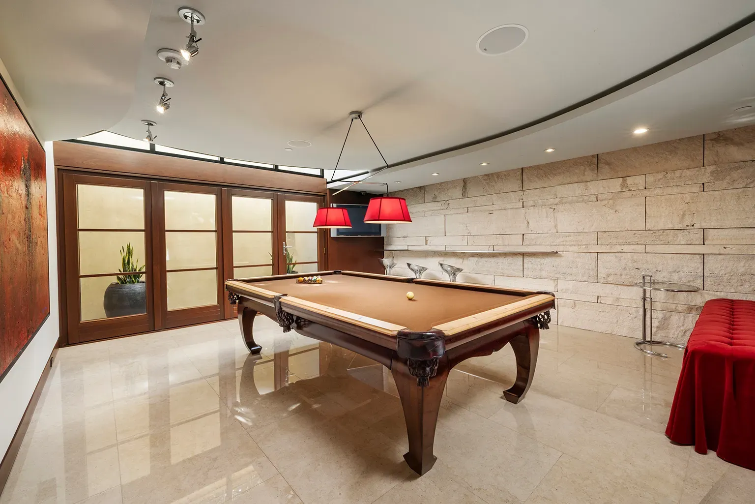 Pool room goes full beige luxe. Stone floor shiny but not slippery, hopefully.