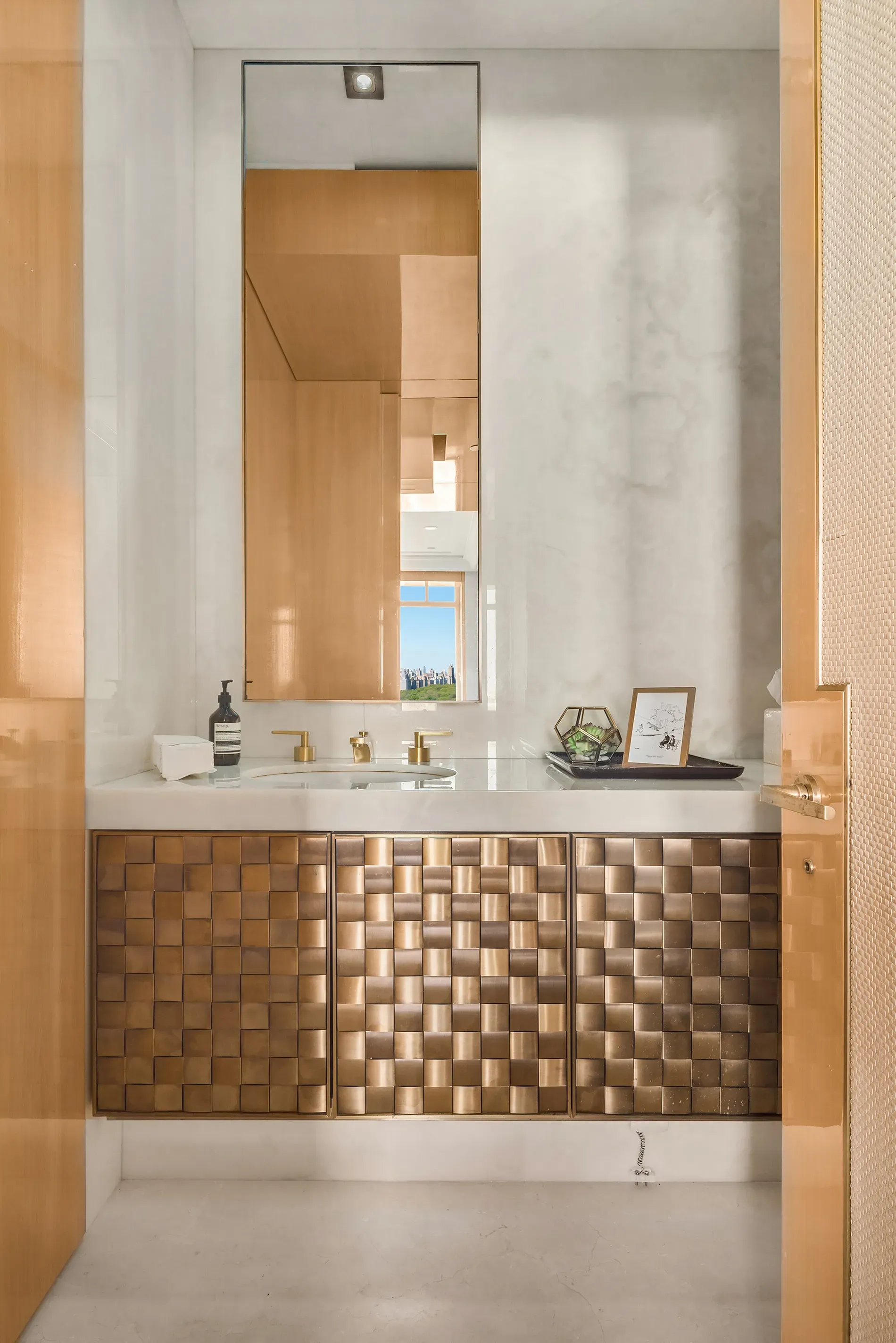 That woven brass vanity is wild. Anyone know why they did this?