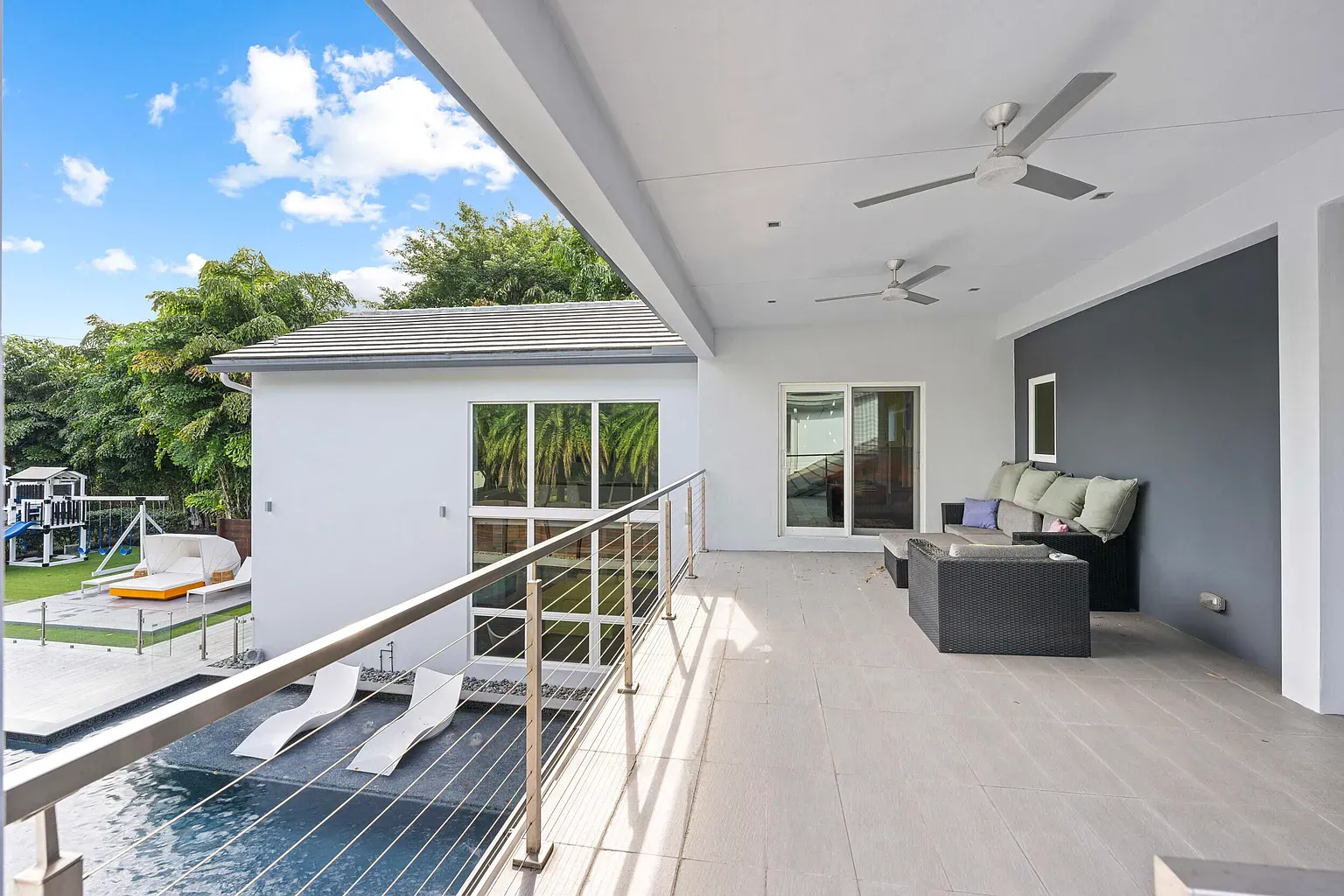 And then a super minimal terrace—gray tile runway to the horizon.