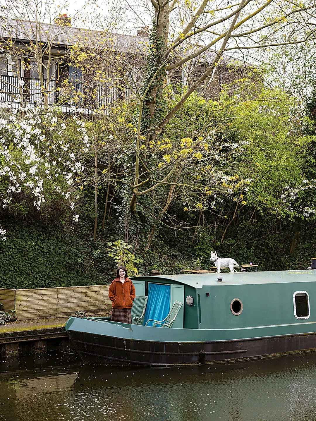 Here’s the narrowboat — deep green on green. Looks peaceful, almost camouflaged.