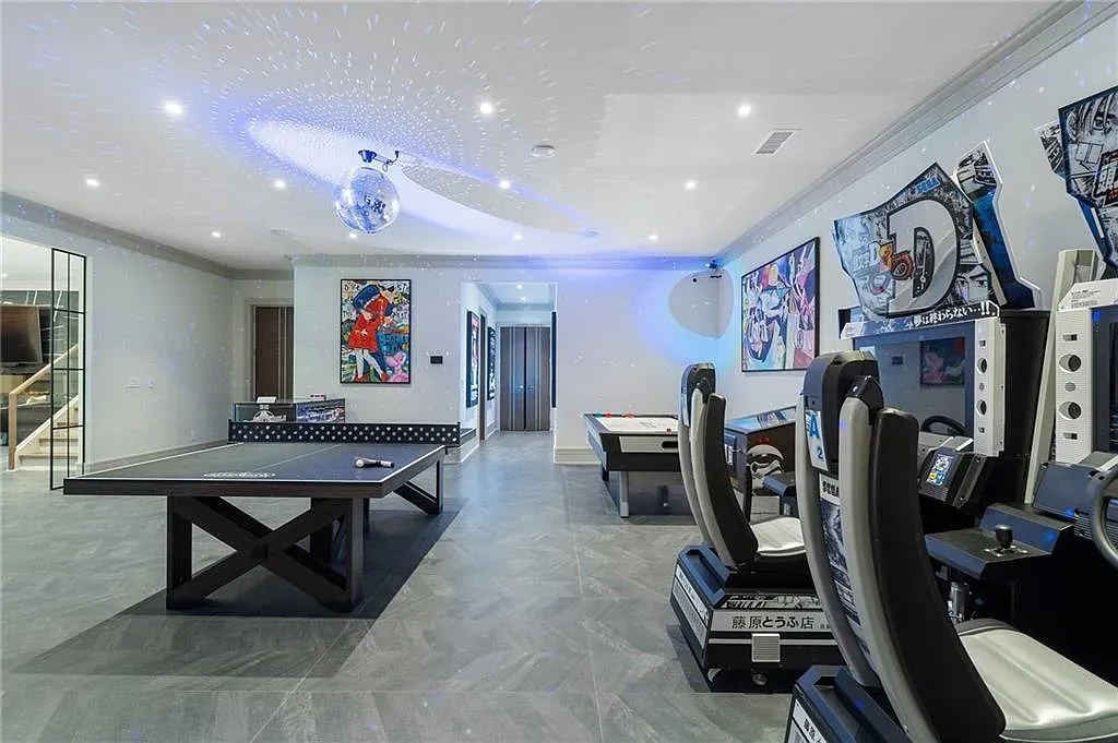 And then a slick ping-pong room. Gray tile so shiny it's a mirror.