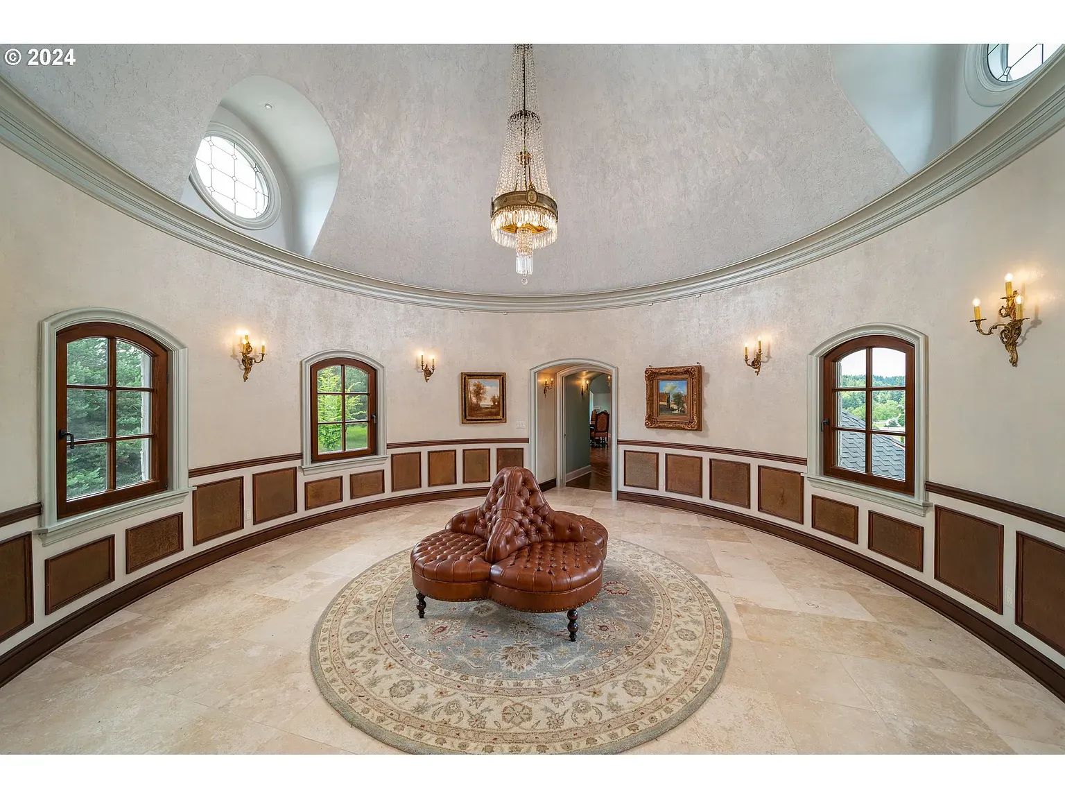 Round room with a vaulted cap—soft neutrals. From this angle it soars.