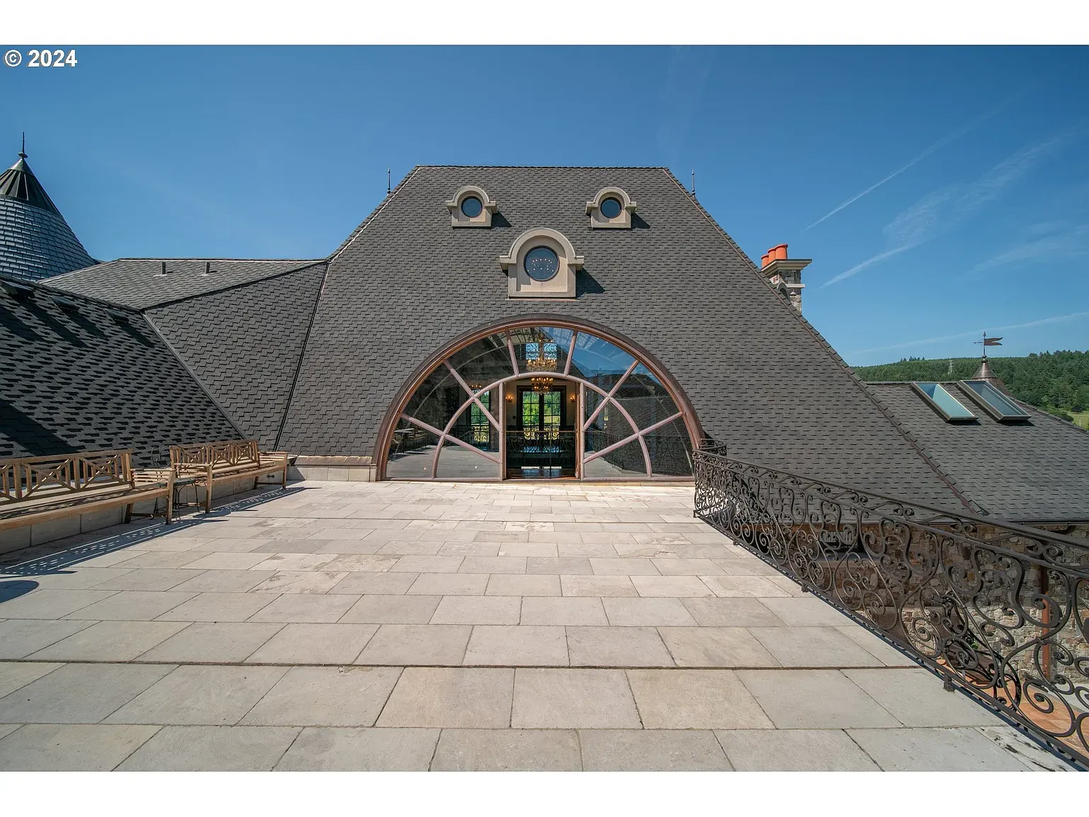 From this angle, the slate peaks and dormers look origami.
