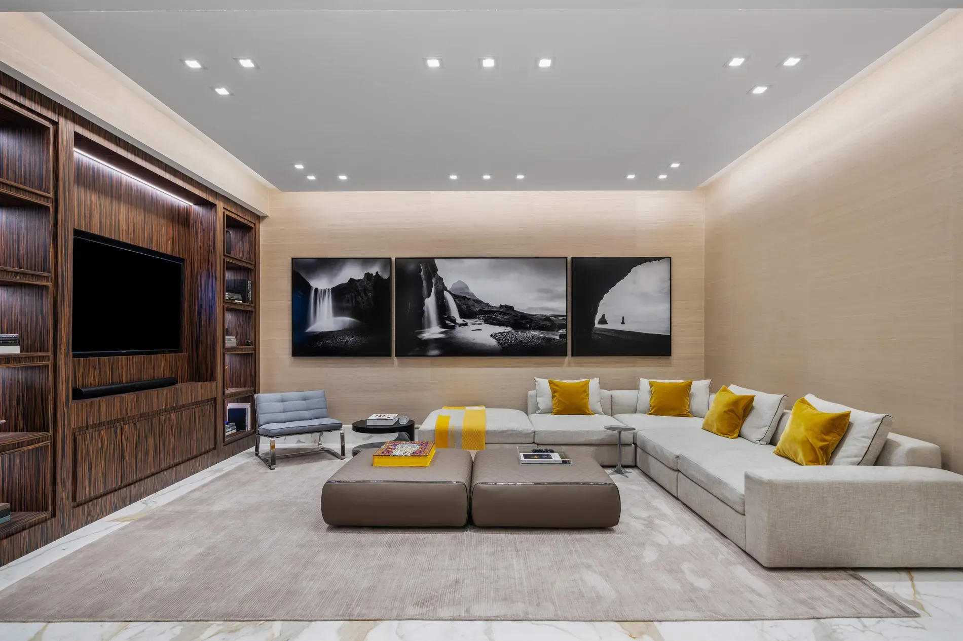 Living room with big sectional and yellow pillows. Simple cheerful pop.
