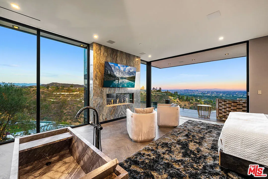 Bedroom view doing the heavy lifting. Floor-to-ceiling everything.