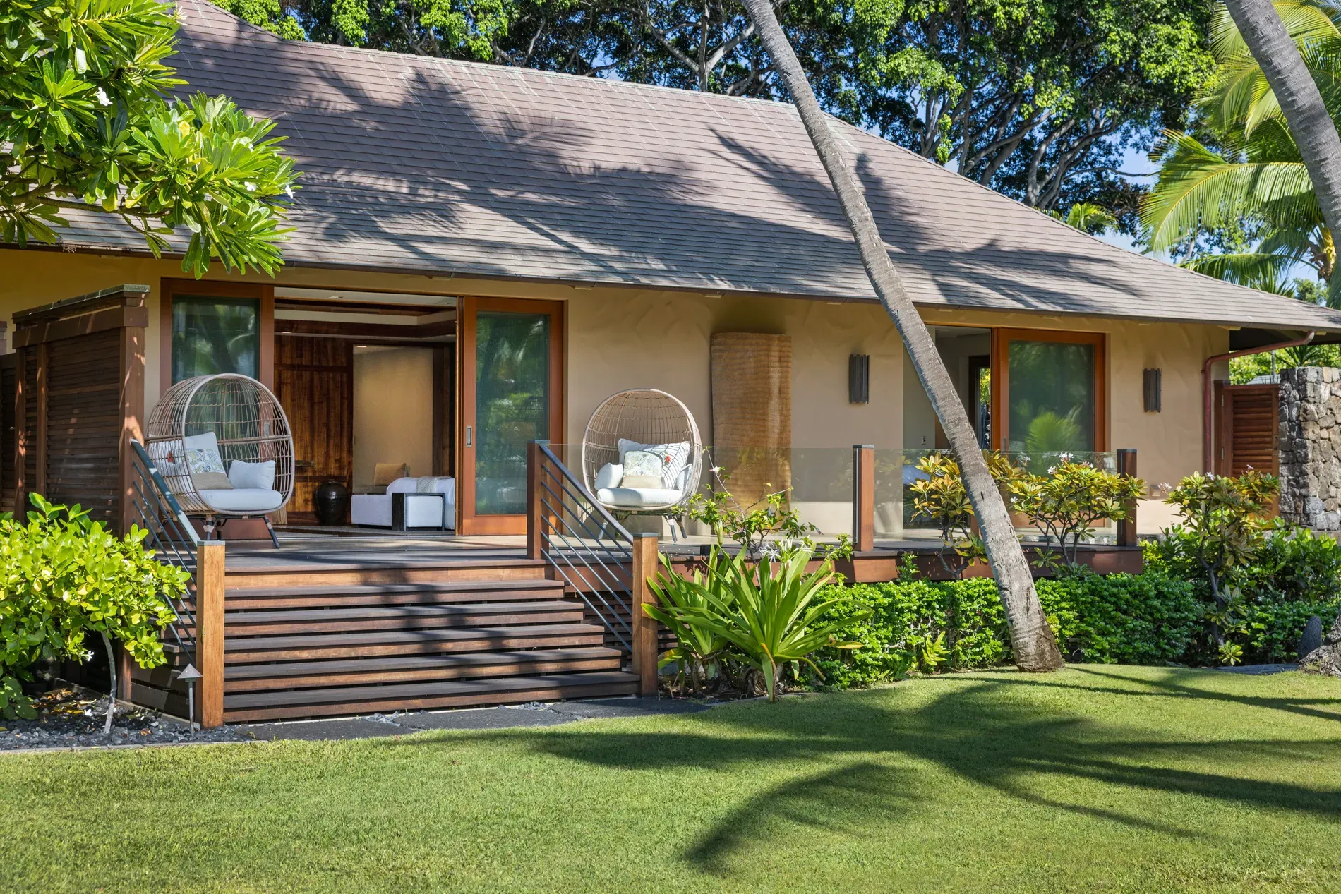 House exterior in sandy beige, dark roof. simple and calm.