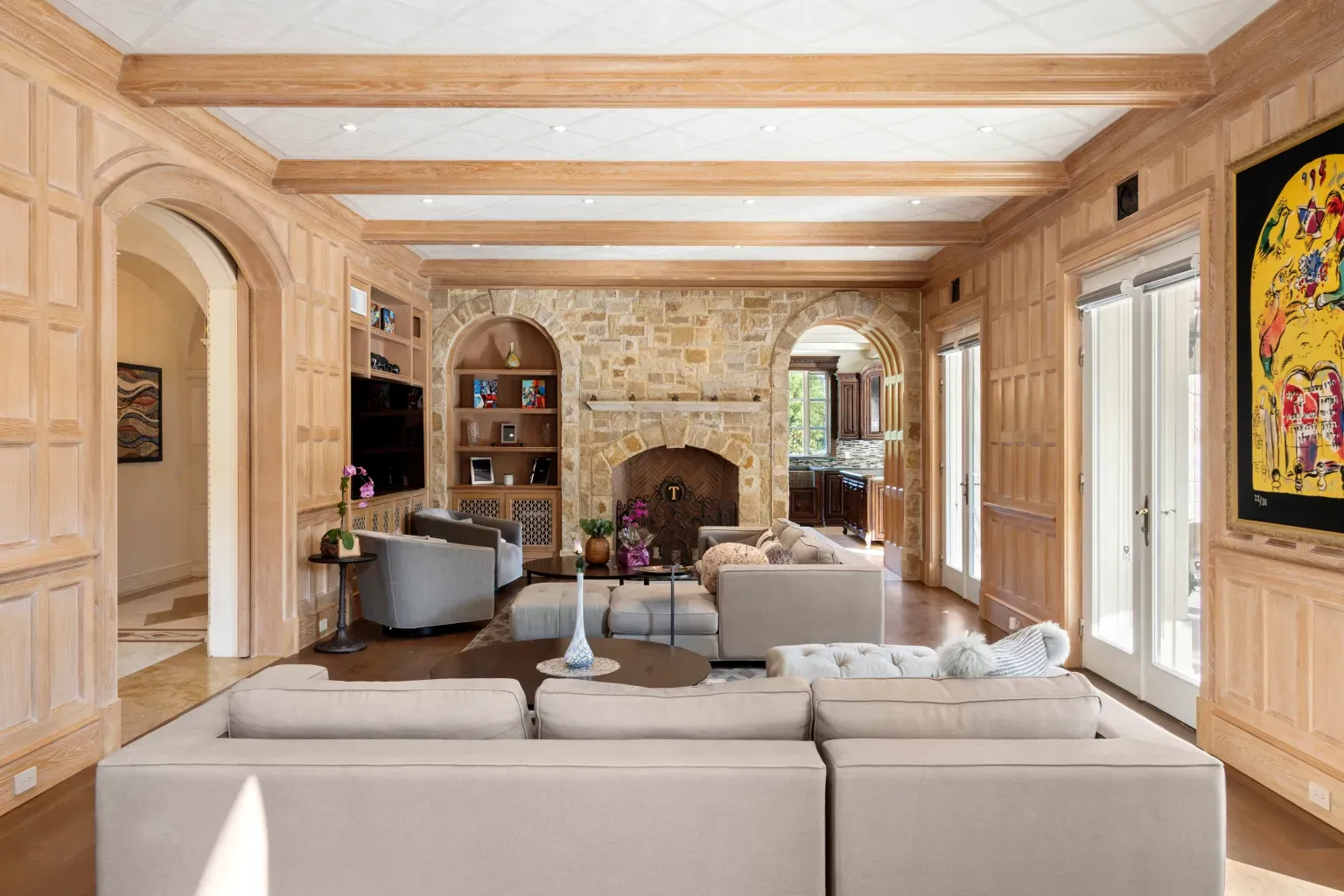 Living room mixes honey wood and modern lines. Cozy, not fussy.