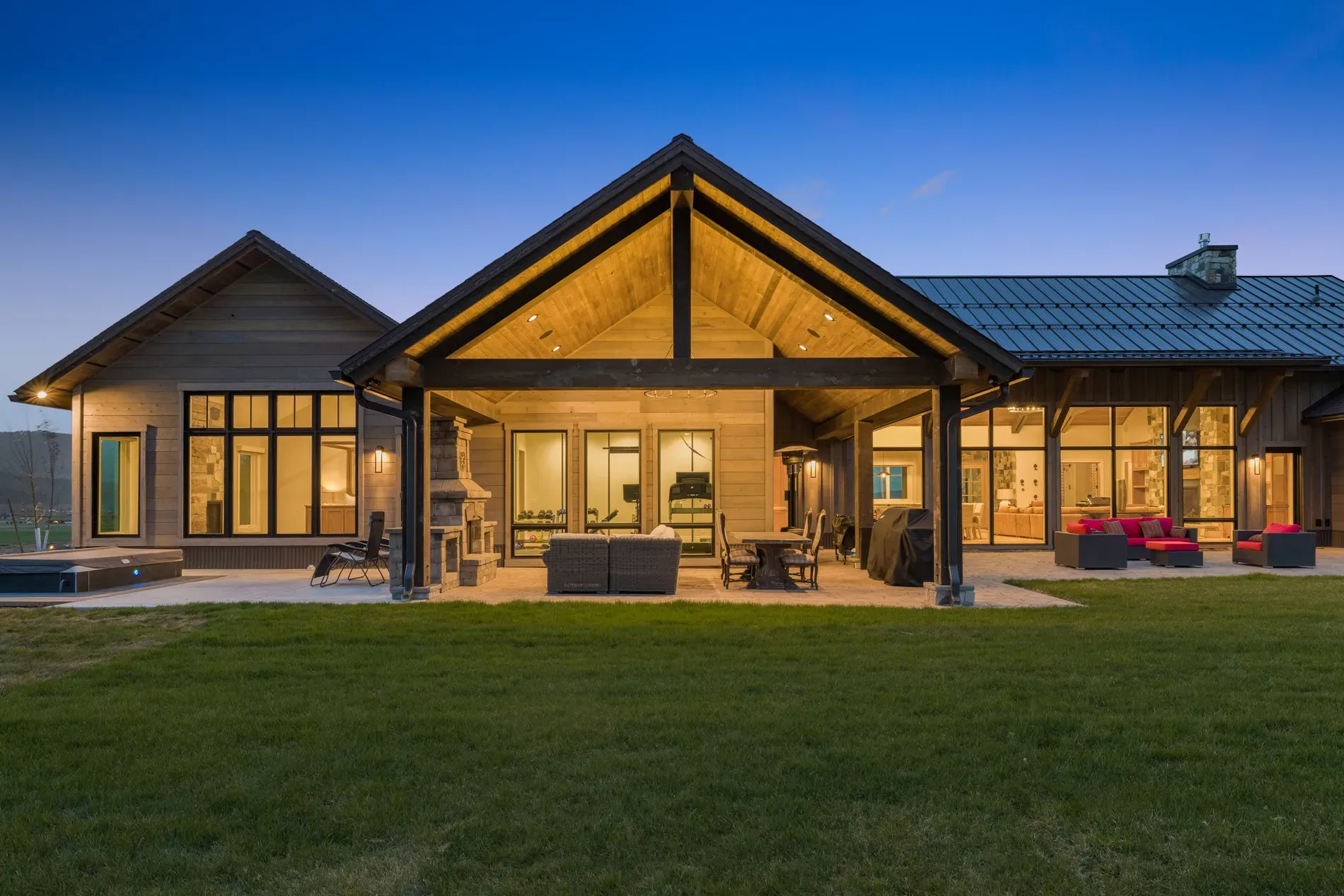 From this angle, the A-frame patio is dramatic. Warm beams, dark trim.