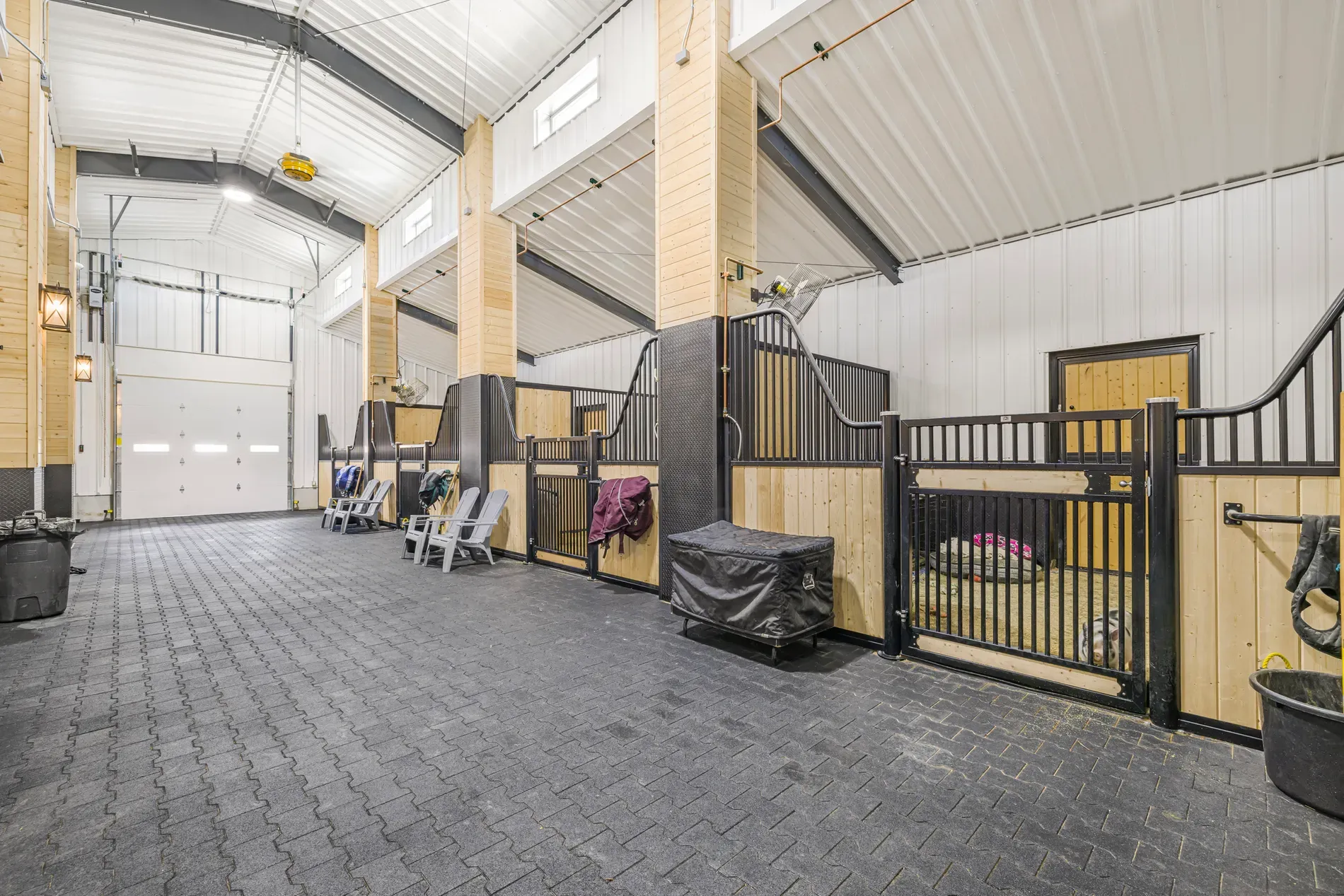 And then the stalls area. vaulted, industrial beams, warm wood panels. Functional but cozy.