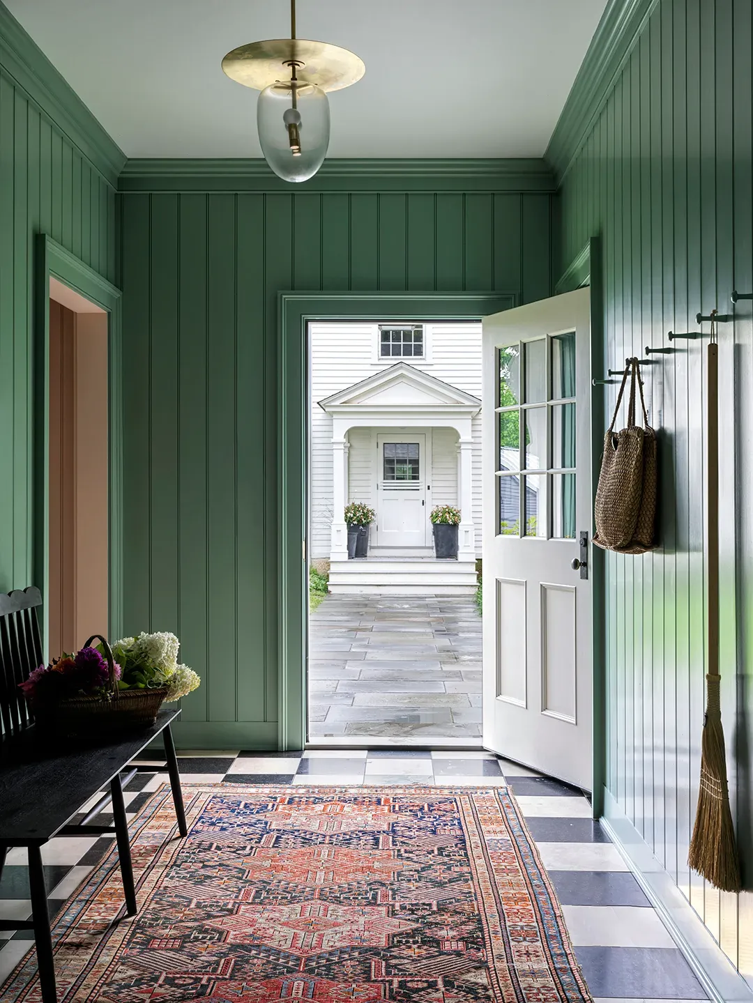 Back to the entry—soft green panels. Fresh without screaming. Boots feel welcomed.