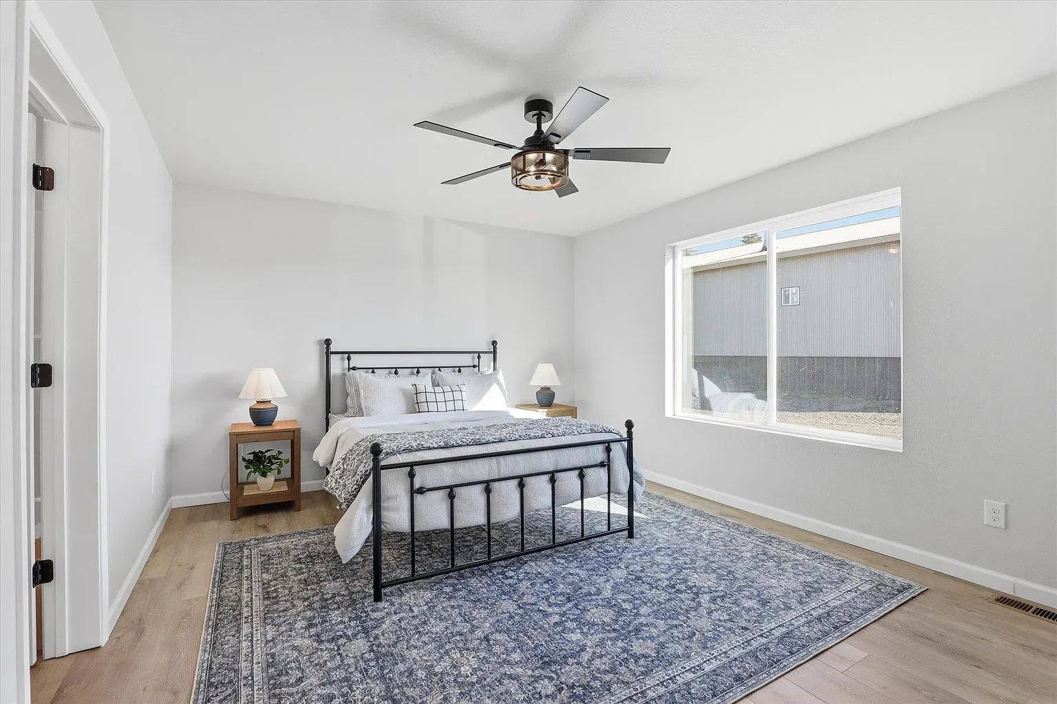 Simple bedroom, black frame pops. Do we the gray-on-gray bedding?