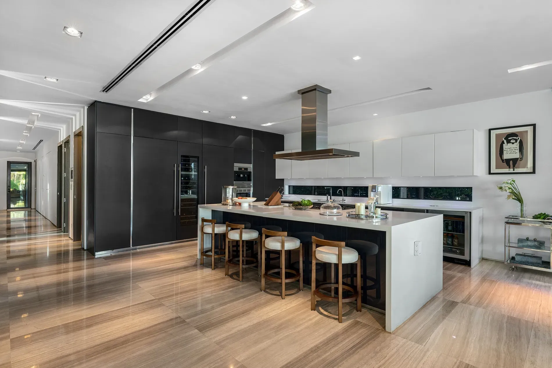Here’s the kitchen — black and white, huge island. Clean but a bit stark.