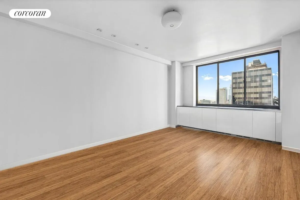 This room is bright and bare. Huge window doing all the work.