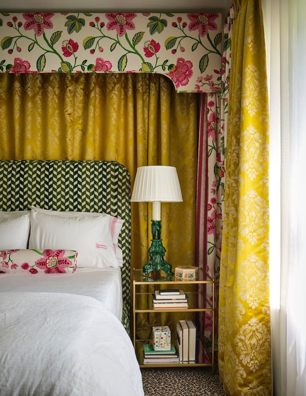 From this angle, chevron headboard against florals—bold on bold. Confident?