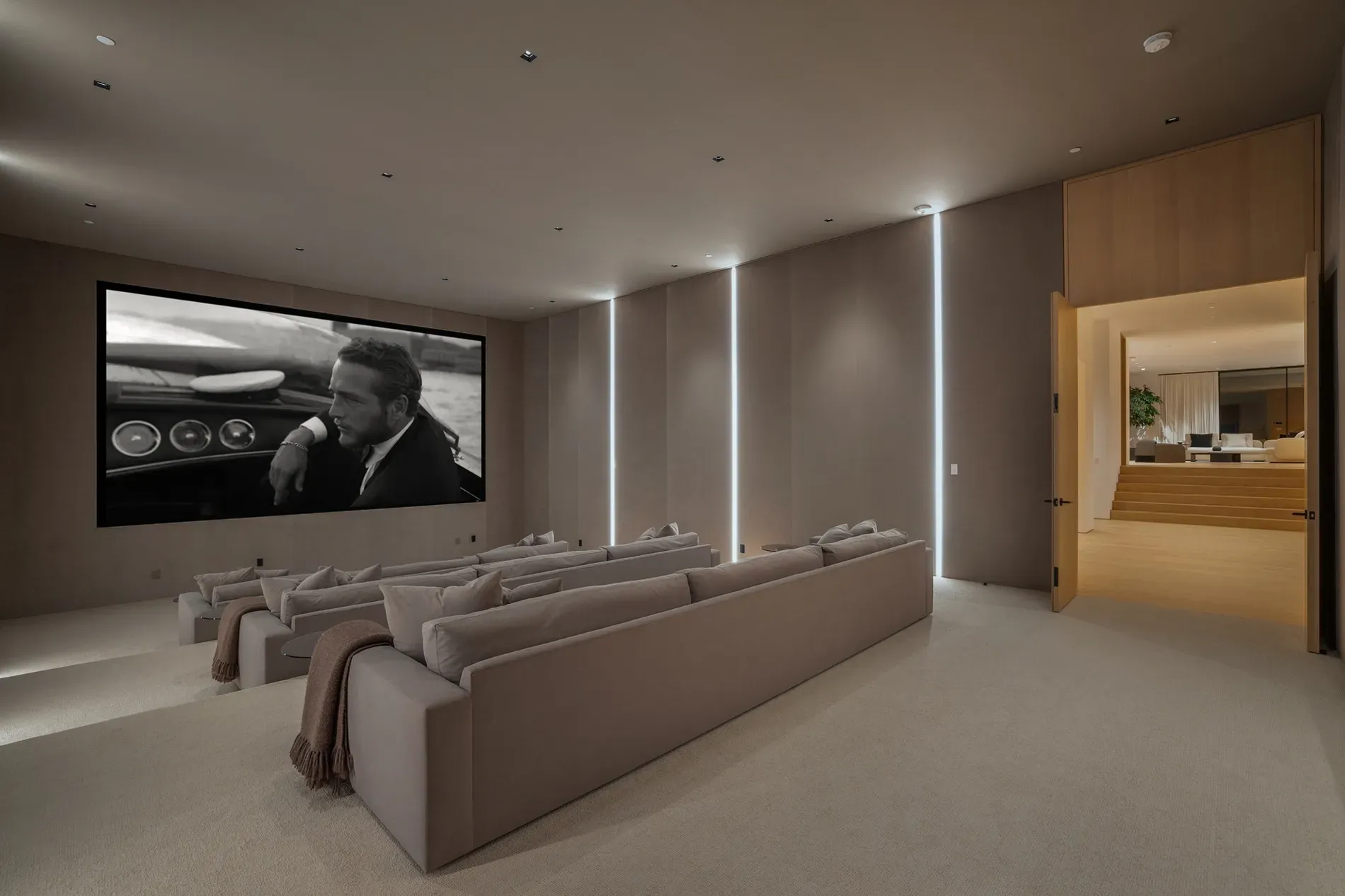 From the back row, that screen eats the wall. Cozy glow.