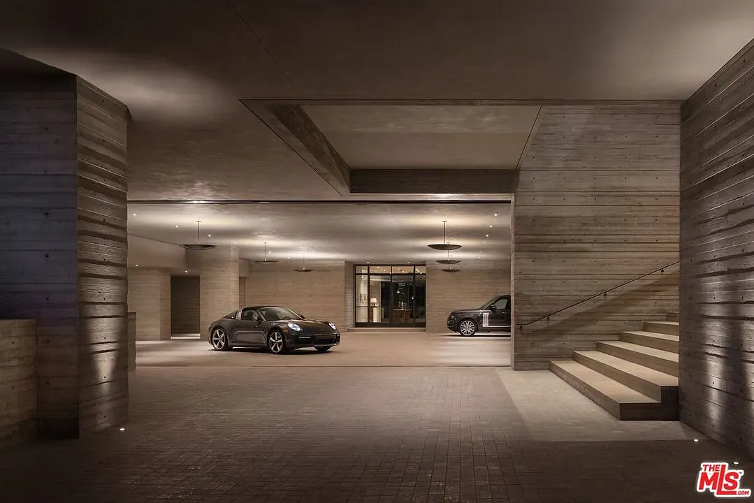 And then the garage — raw concrete, strip lights. Feels a Bond scene.