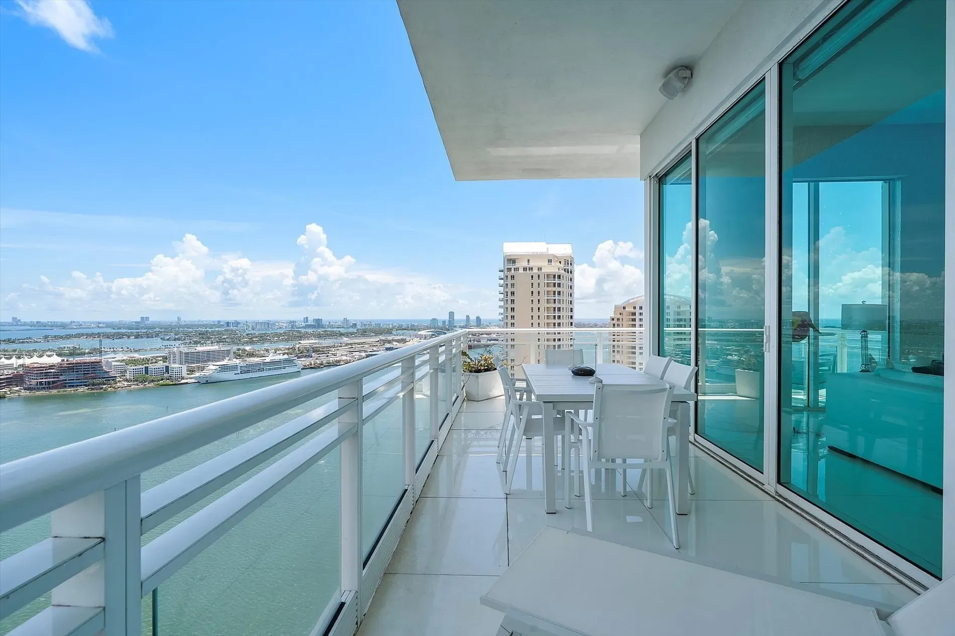 Here's the balcony—glass rails, water for days. Gorgeous, but pricing this high?