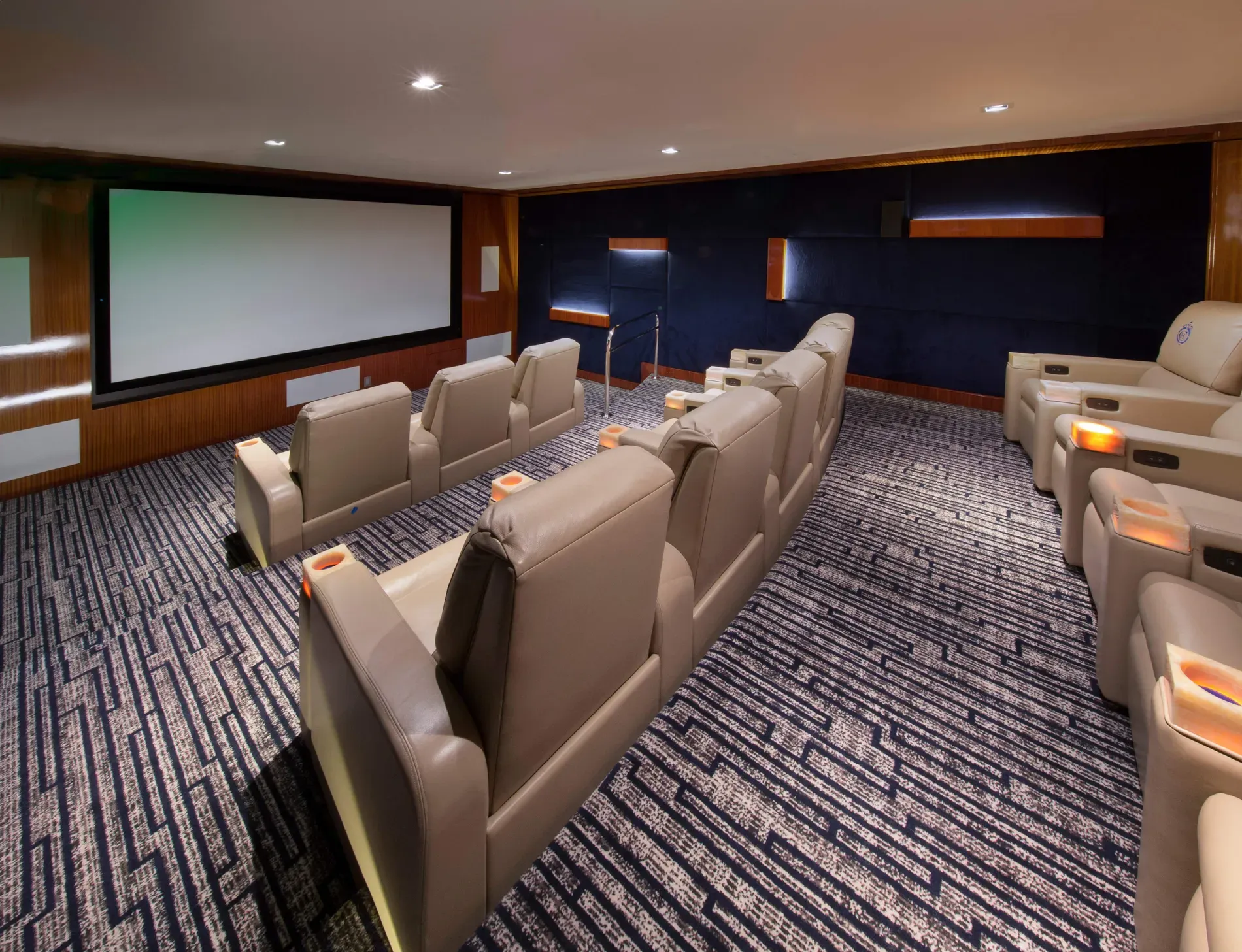 And then the home theater—plush beige recliners. Not sure about color.