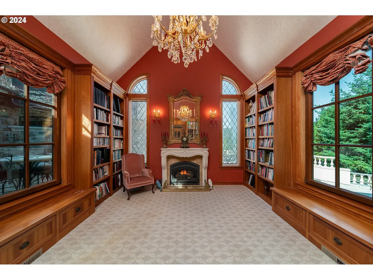 Here’s the library—deep red walls, tall arches, dramatic drapes. Feels cozy-grand.