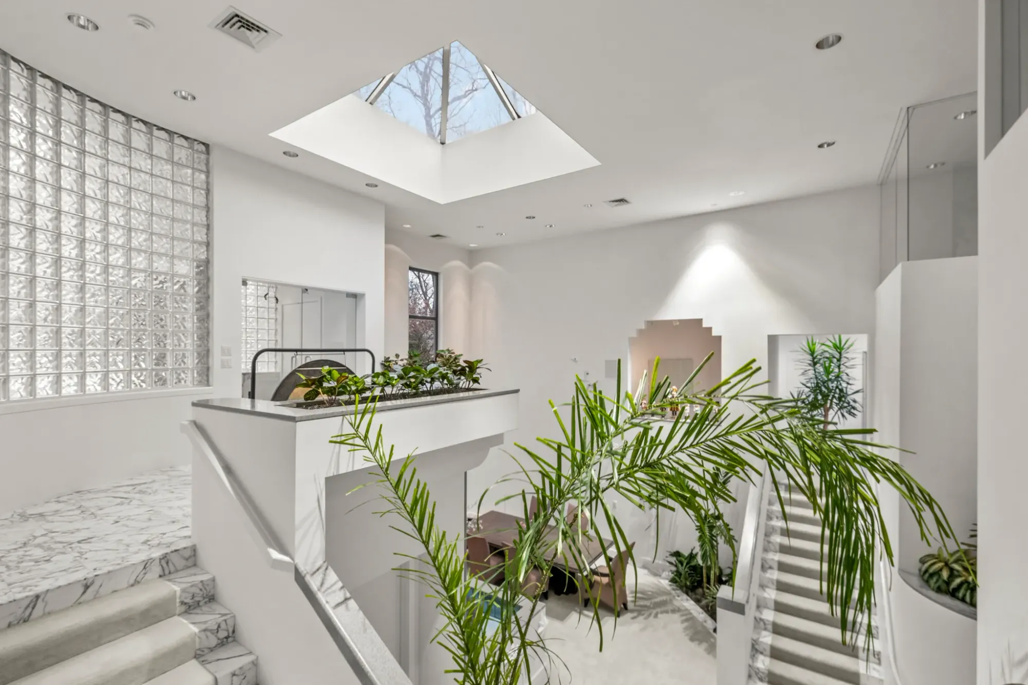This angle makes the skylight look massive. Warm wood plus stone actually works.