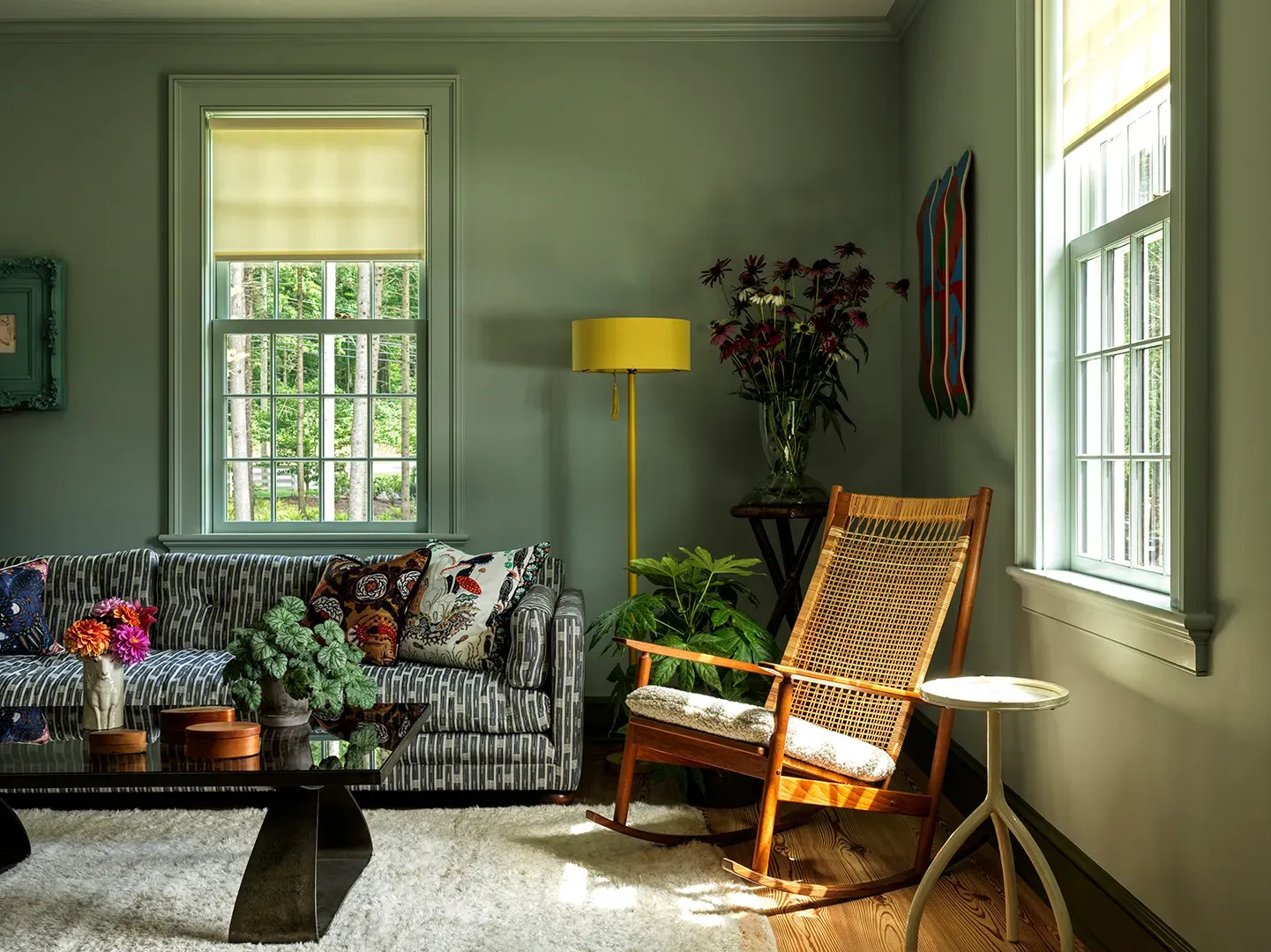 Here's a mellow living spot—soft green walls, gentle light. Easy Sunday energy.