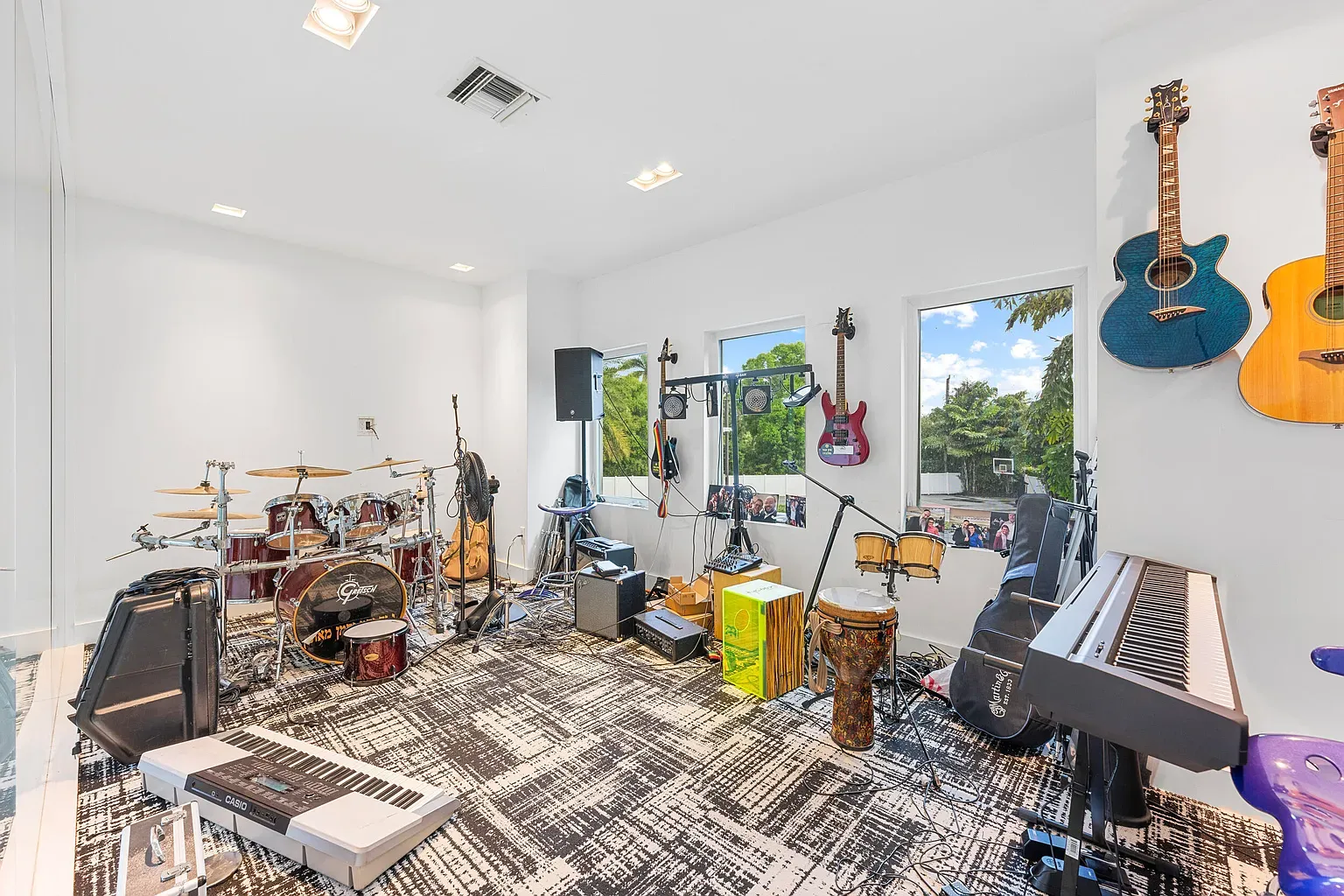 Music room with giant windows. Jam session plus big-view screensaver vibes.
