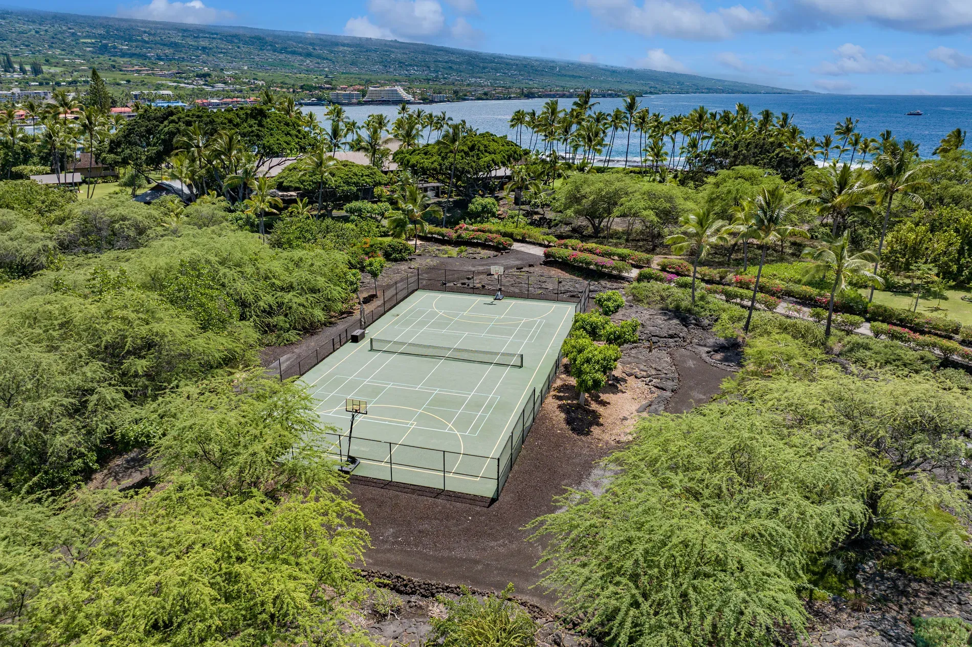 Soft green court with a black fence — not sure about that combo.