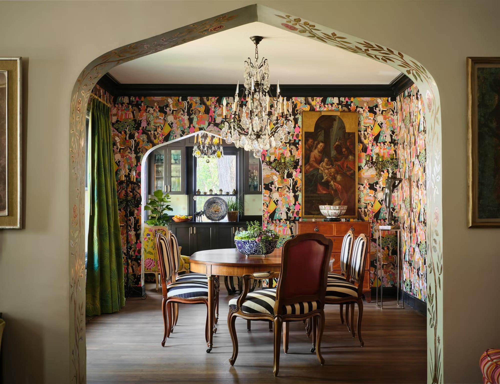 Another angle into the dining room—arched entry, eclectic colors. Rulebook shredded?