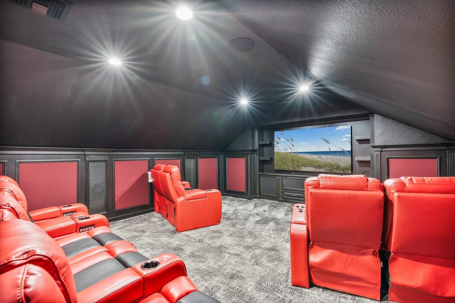 Okay, the theater—red recliners, matte black cave. Looks legit.