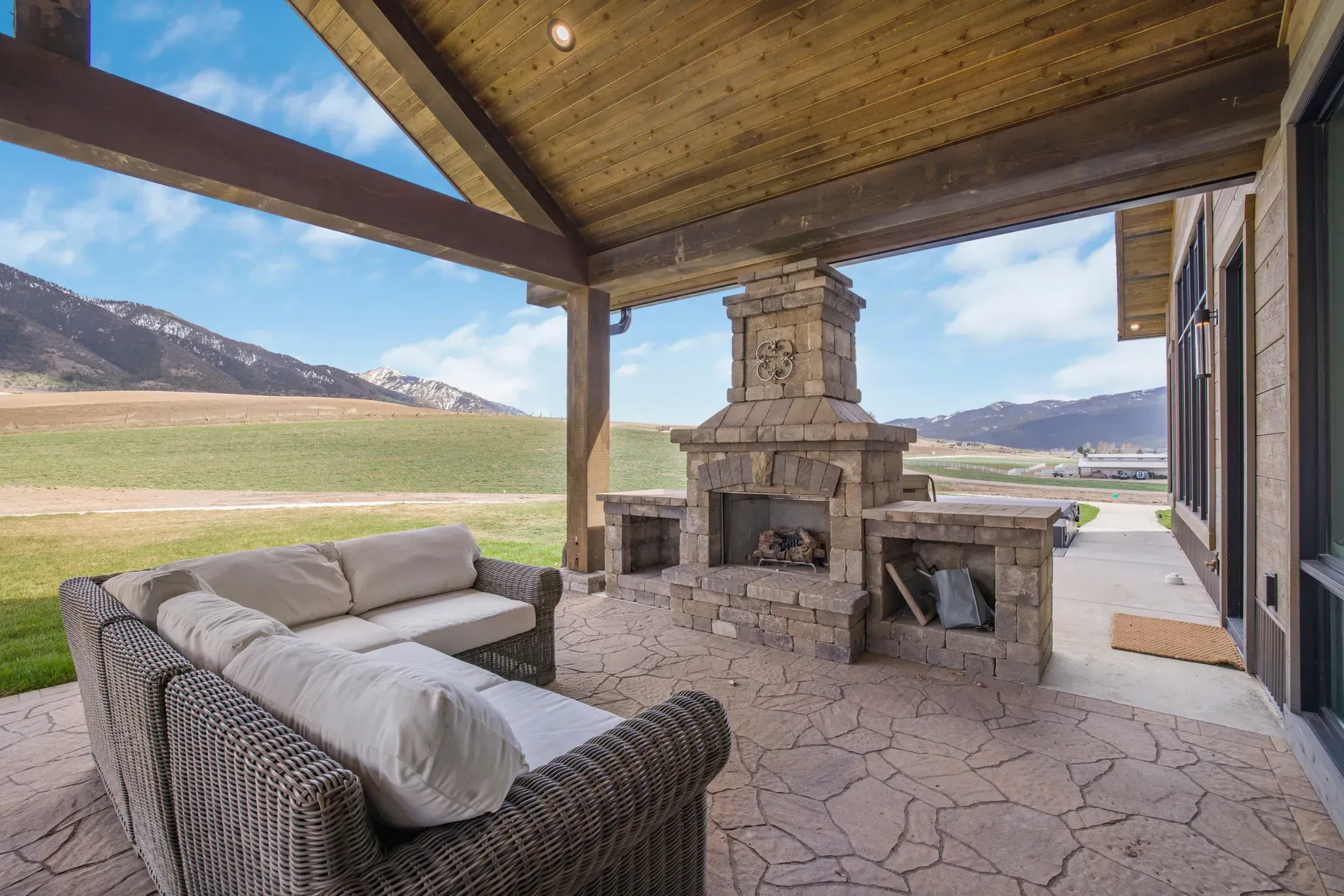 Stone fireplace corner looks straight from a lodge. Anyone else craving s'mores immediately?