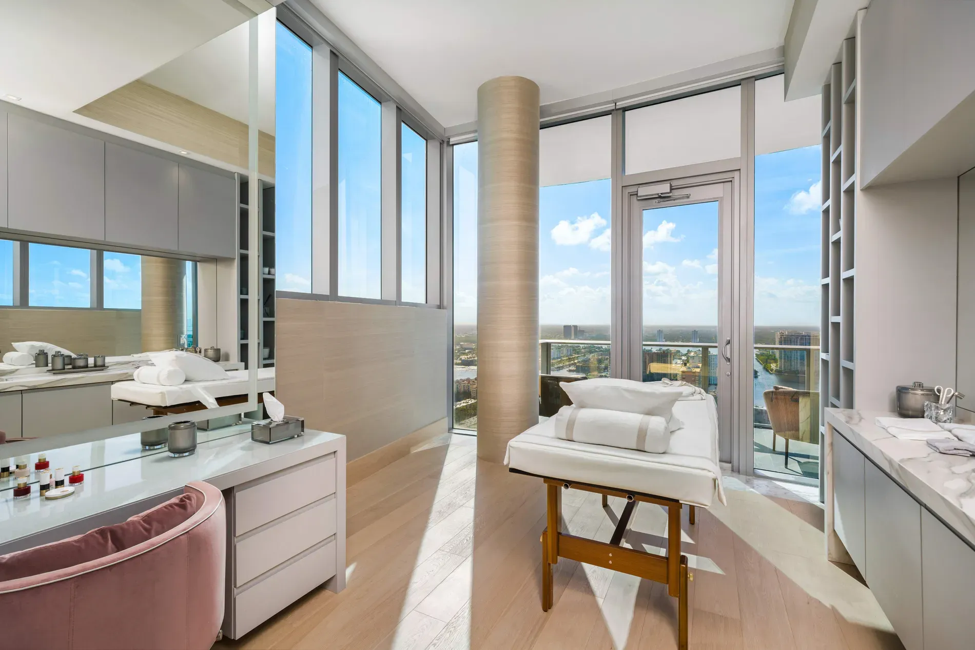 High-rise spa corner. Warm neutrals, city panorama doing yoga for my brain.