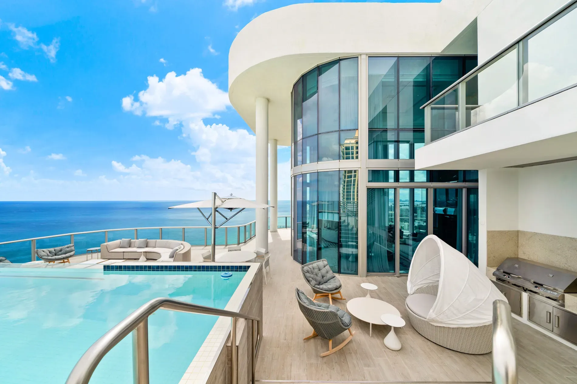 Back outside—another infinity edge. Pale deck keeps it calm.