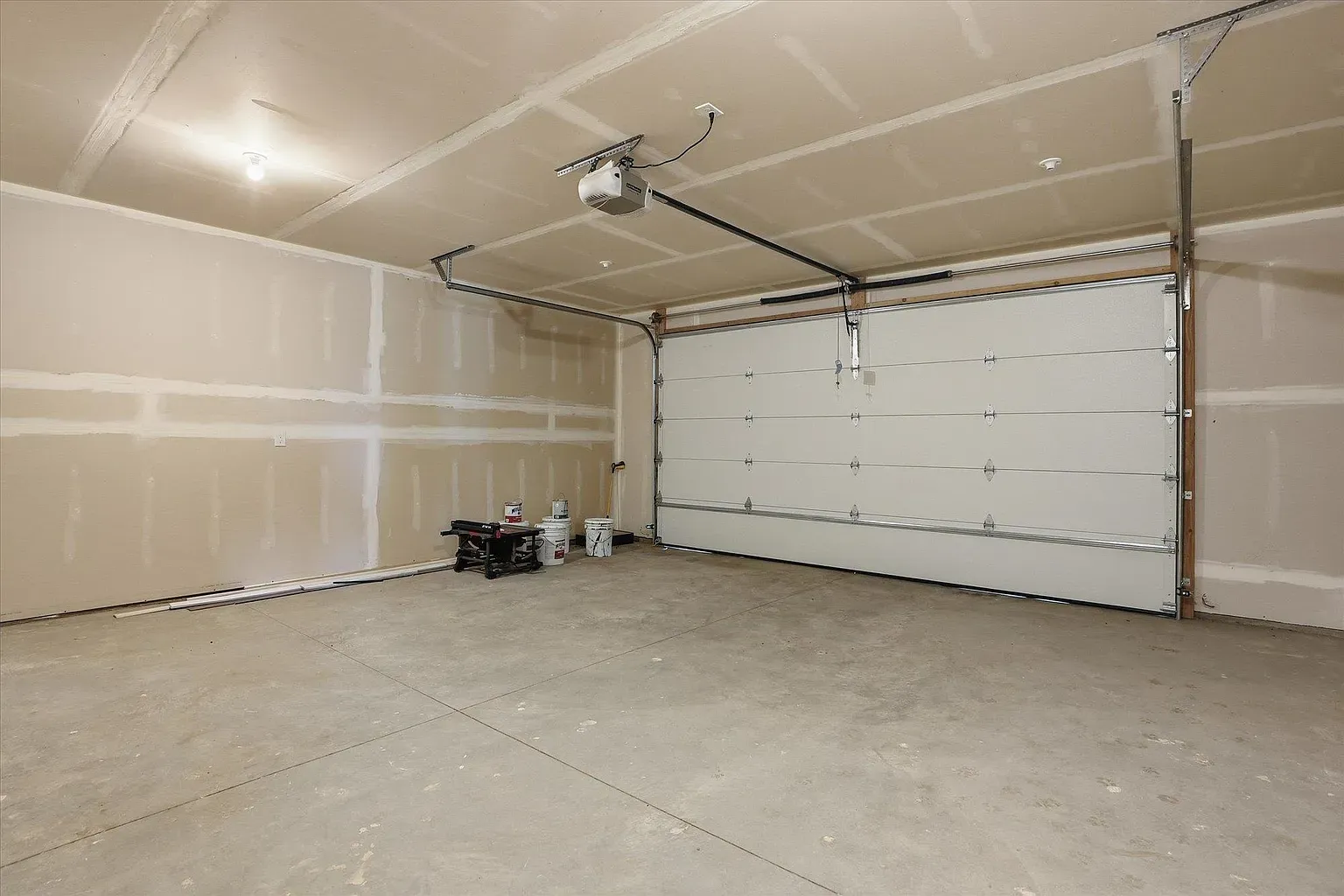 Garage is still drywall and dust. Project zone. Where’s the shelving going?