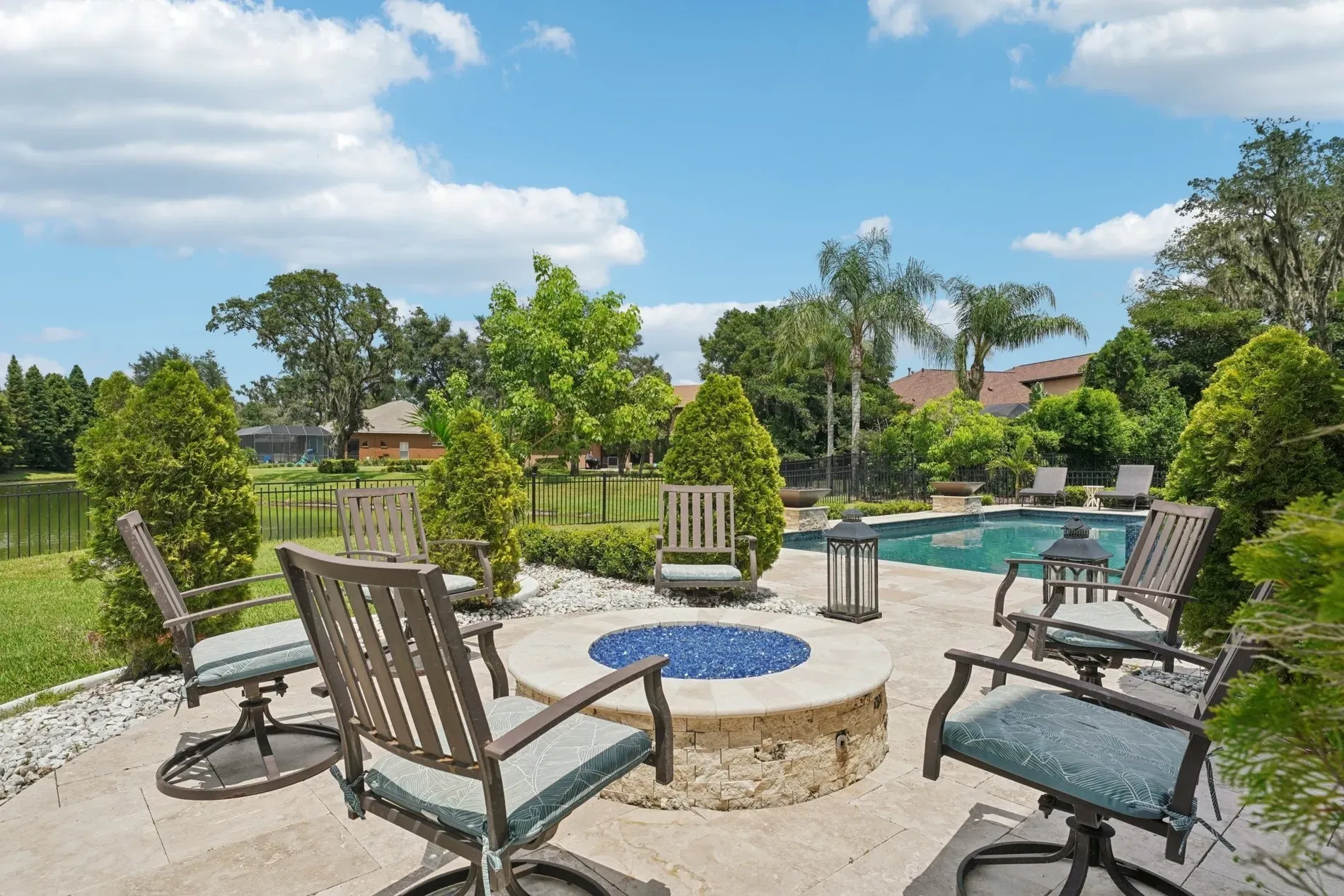 Fire pit patio with blue glass sparkle. Looks cozy. where's the s'mores?