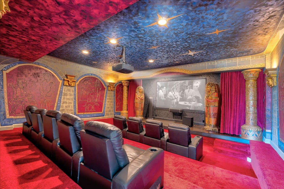 And then the theater goes full Pharaoh. Red velvet, gold trim, hieroglyphs everywhere. Bold.