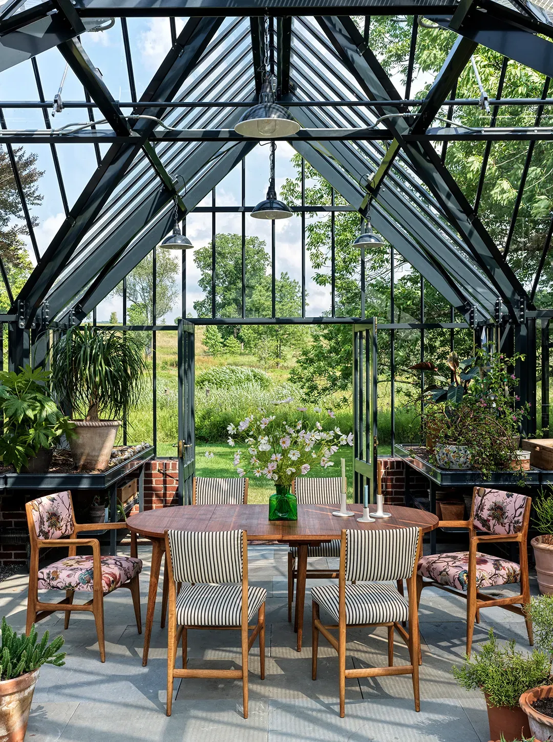 From this angle, the greenhouse dining looks a conservatory. Dinner in a terrarium?