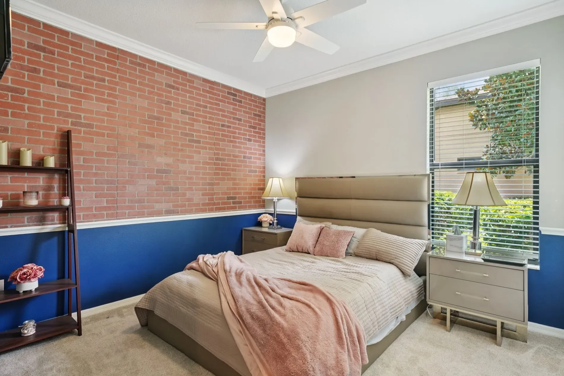 Modern-rustic bedroom. Upholstered bed against a textured wall—cool mix, not overdone.