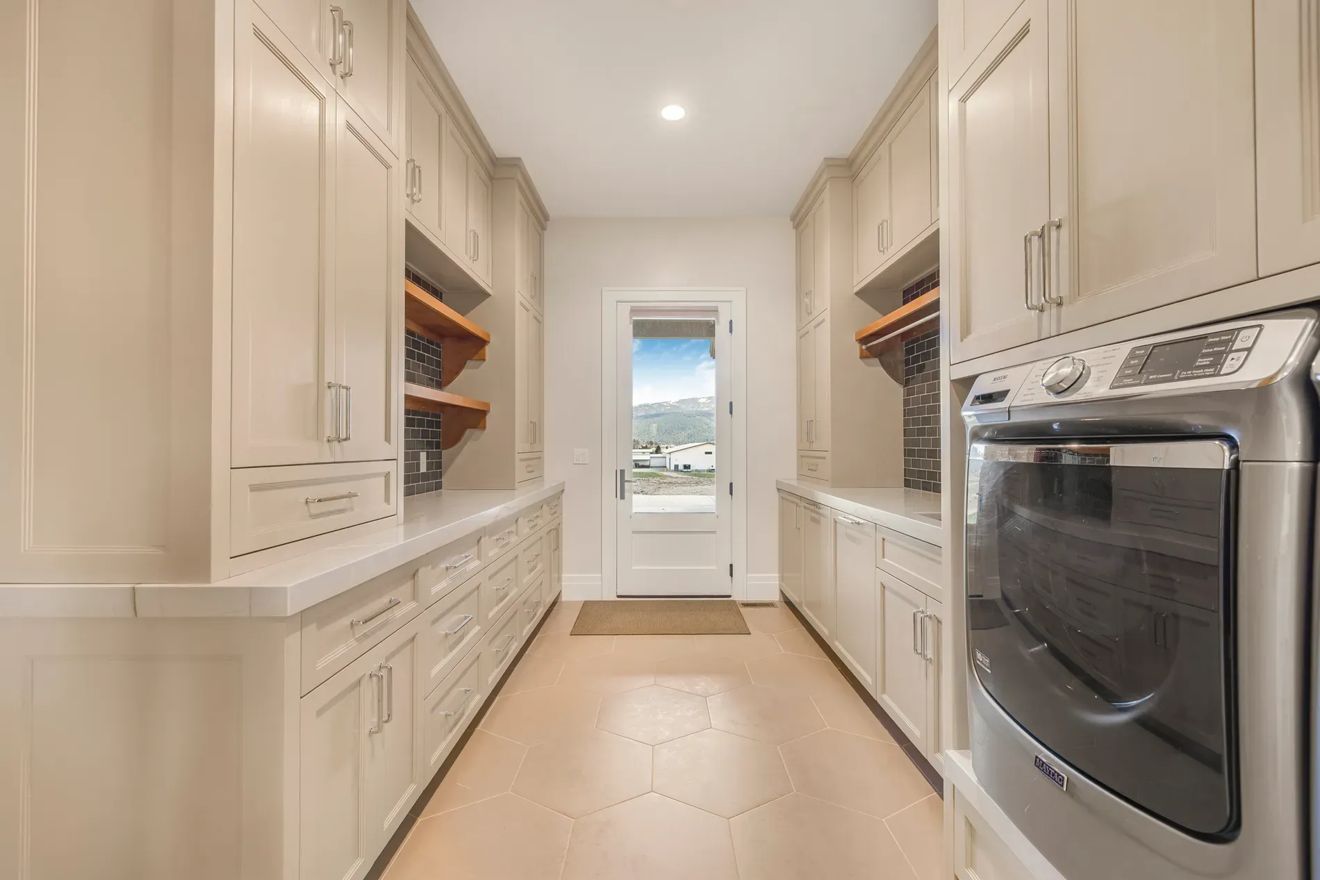 Here's the kitchen hallway — creamy cabinets, white tops. Clean, but maybe too safe?