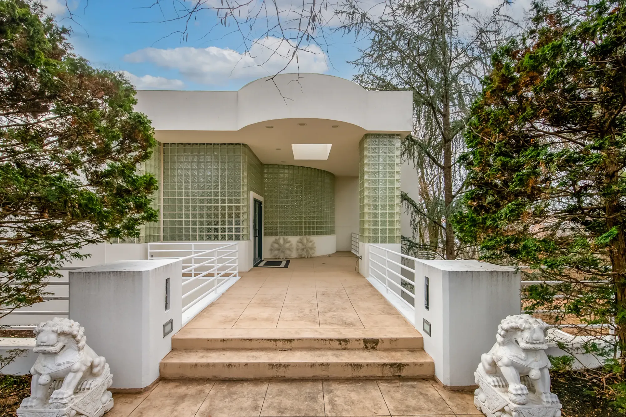 Front entrance again — smooth white and glass blocks. Anyone know why the blocks?