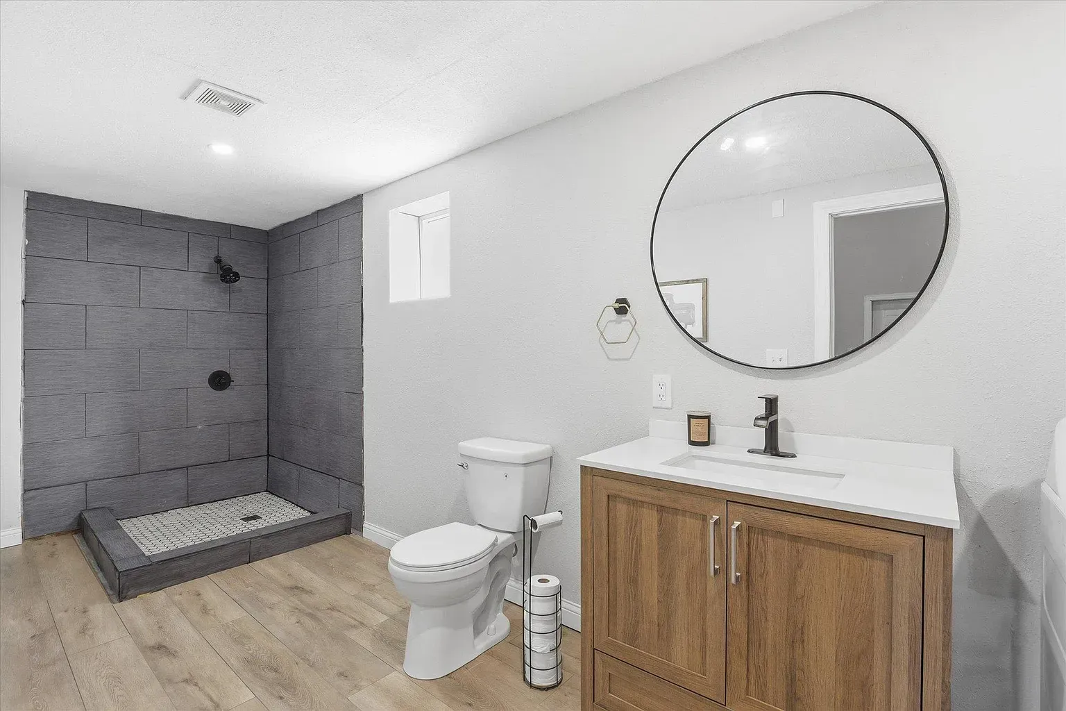 Here’s the bath—minimal, bright, big shower. For $950k, I expected a skylight.