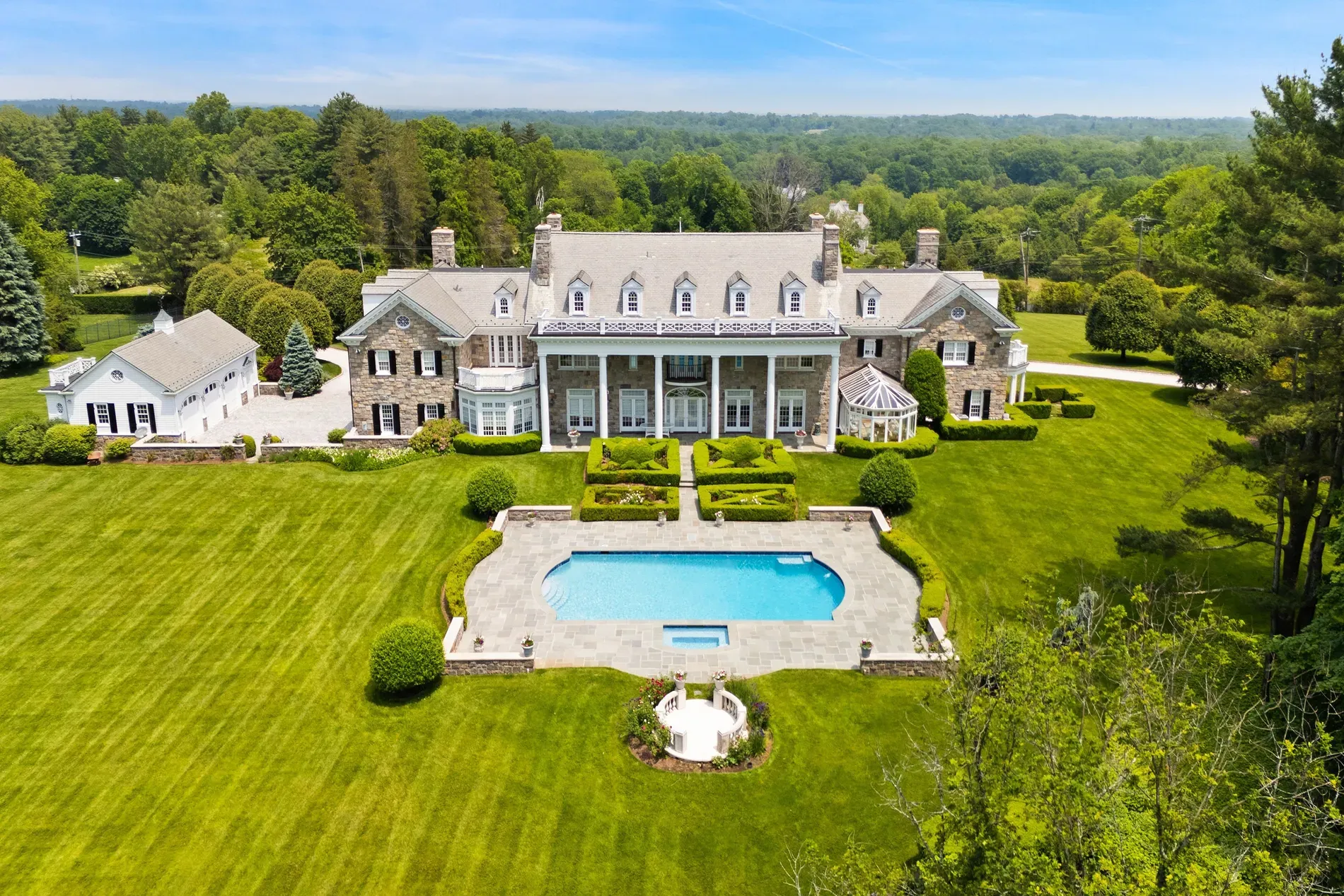 Back outside — brick and stone mix, soft neutrals. Anyone know why both?