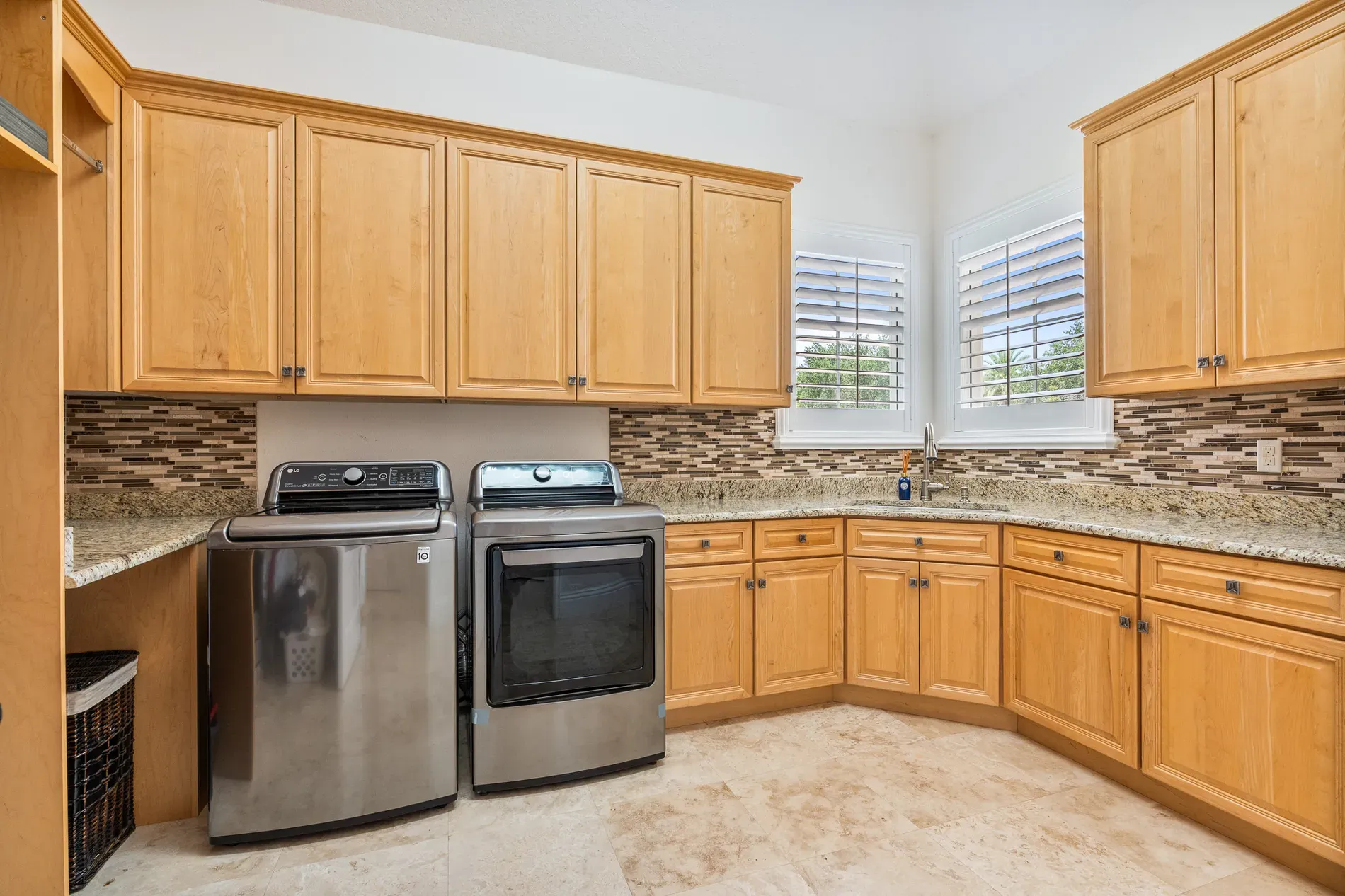 Warm wood kitchen, simple pulls. Granite counters doing the sparkle thing.