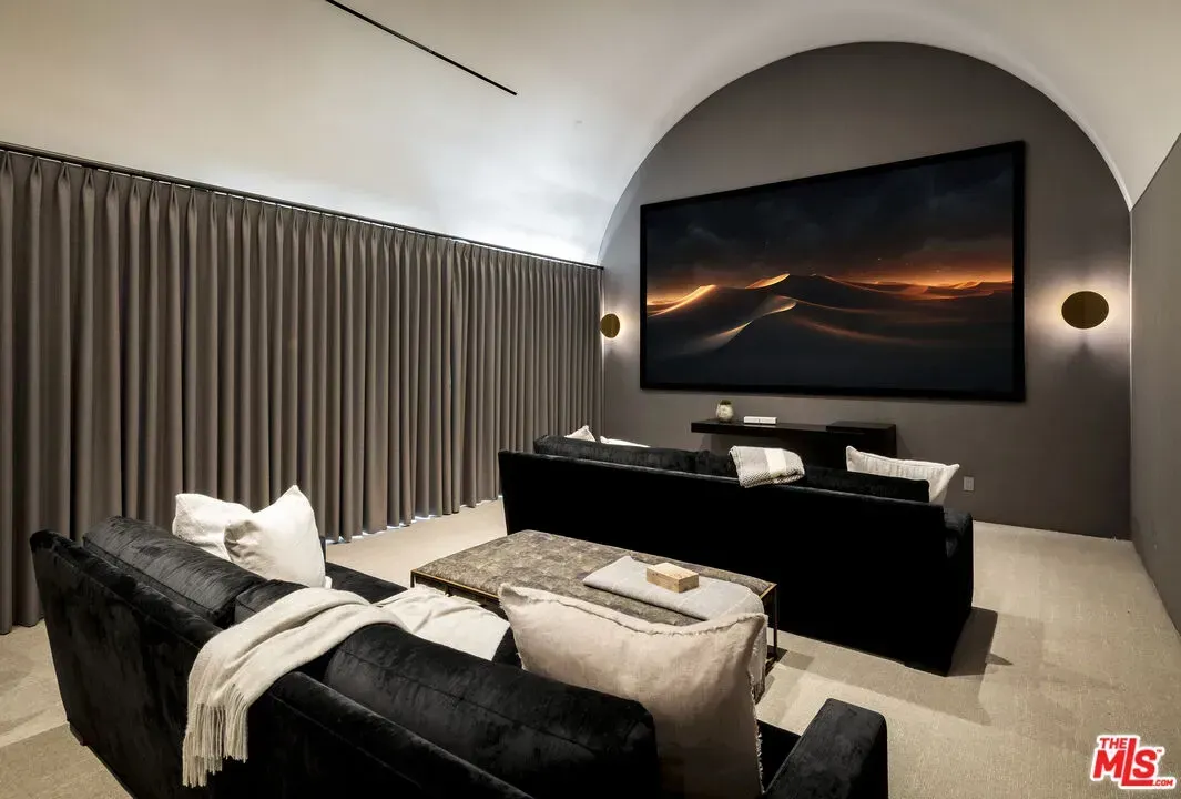 Theater time. That curved ceiling is wild. Anyone know why they did this?