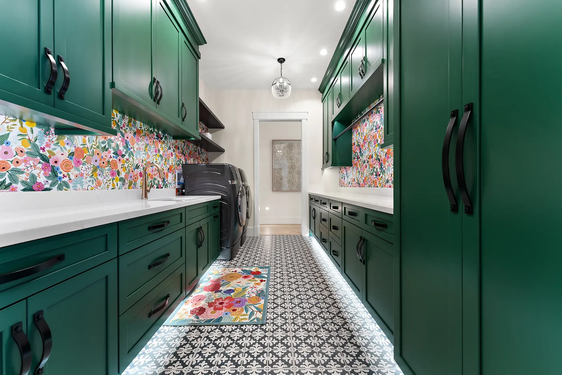 Laundry got the fun room. Bold florals, deep cabinets, actually delightful.
