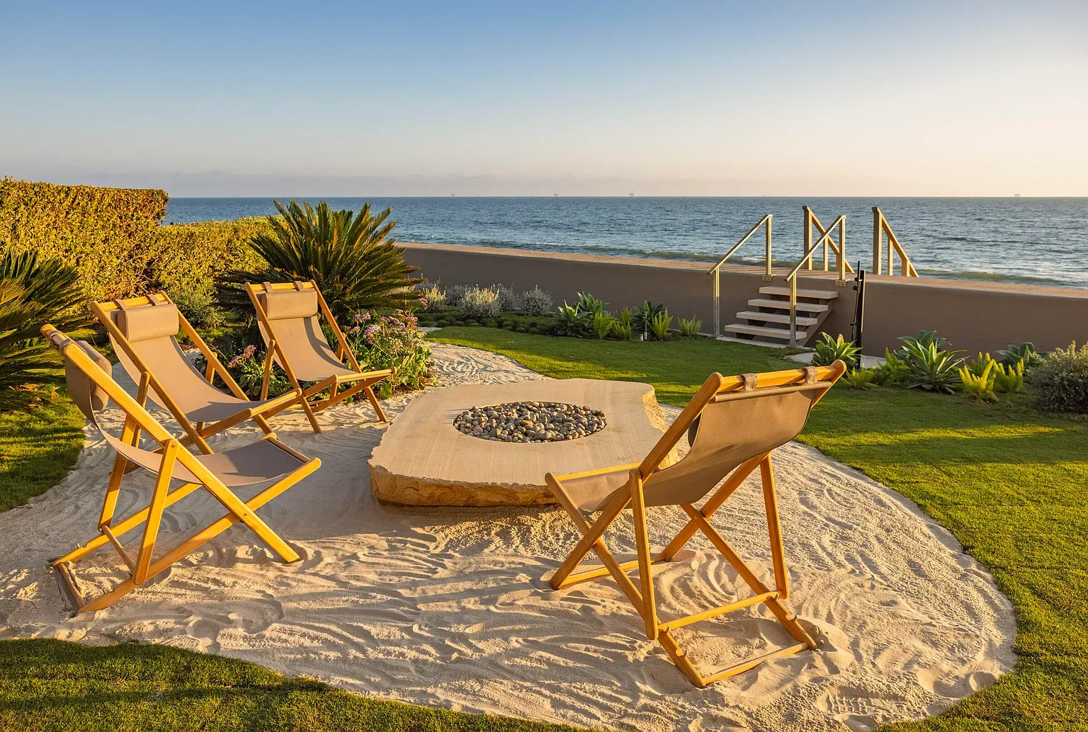 Fire pit on its own little beach. S'mores with ocean soundtrack.